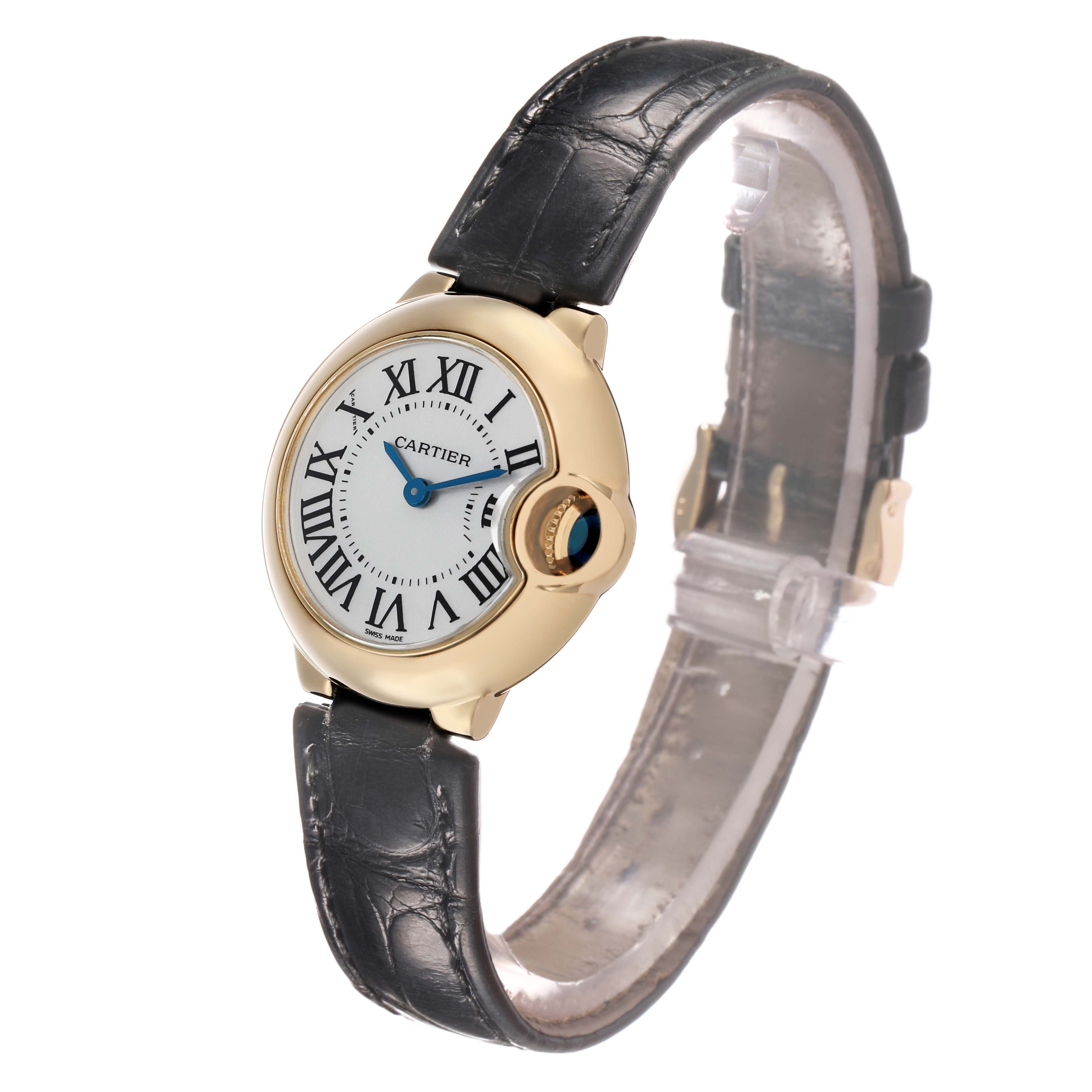 The Cartier Ballon Bleu W6900156 Women's Yellow Gold Silver Dial watch is shown from a front-left angle, highlighting the face, crown, and black leather strap.