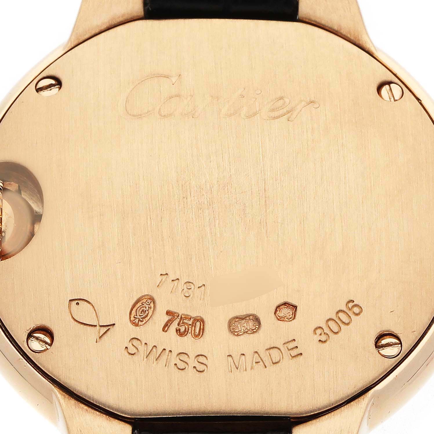 The image shows the back case of a Cartier Ballon Bleu W6900156 Women's Yellow Gold Silver Dial watch with engravings and hallmarks visible.