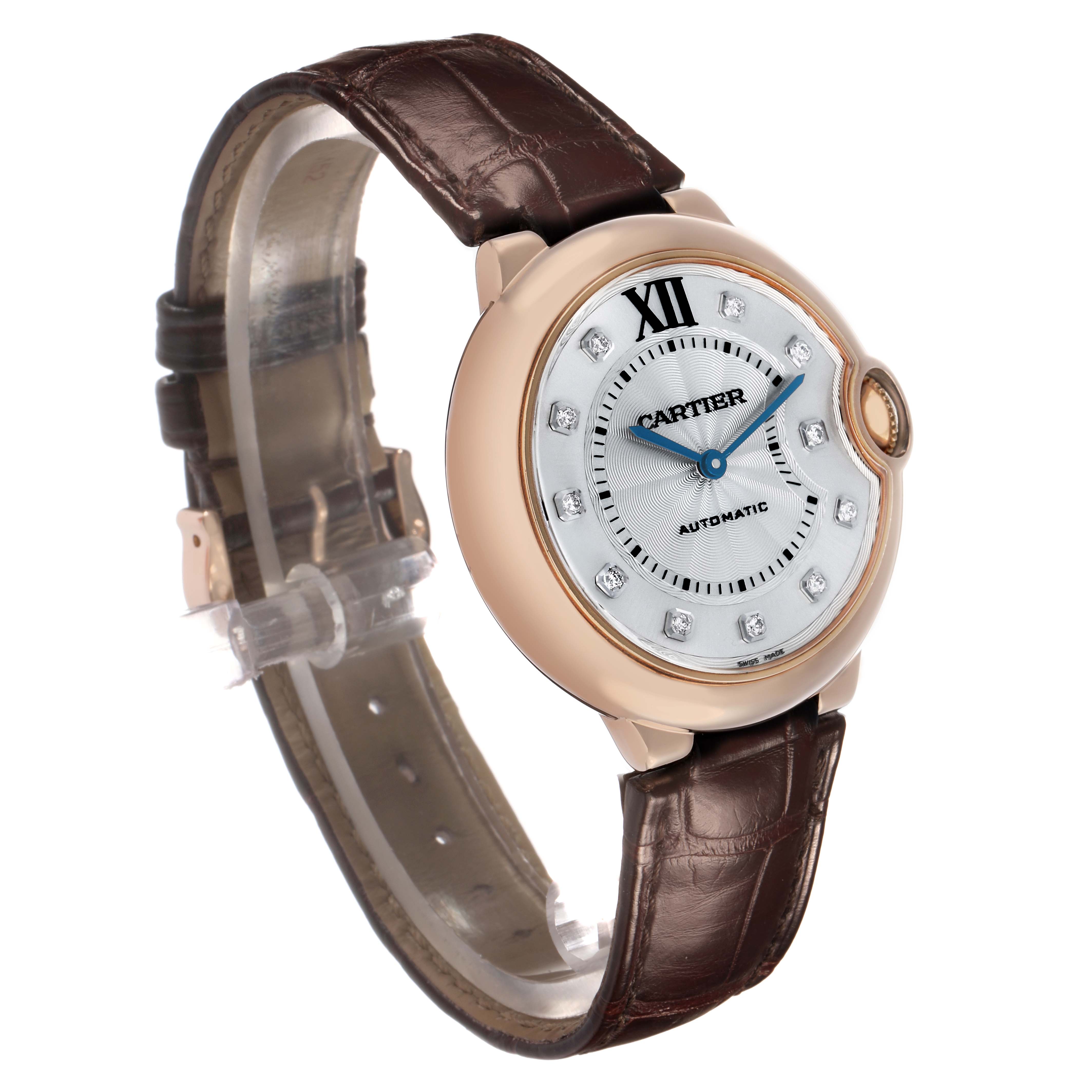 The Cartier Ballon Bleu WJBB0010 Women's Rose Gold Silver Dial watch is shown at a three-quarter angle, displaying its face, case, and leather strap.