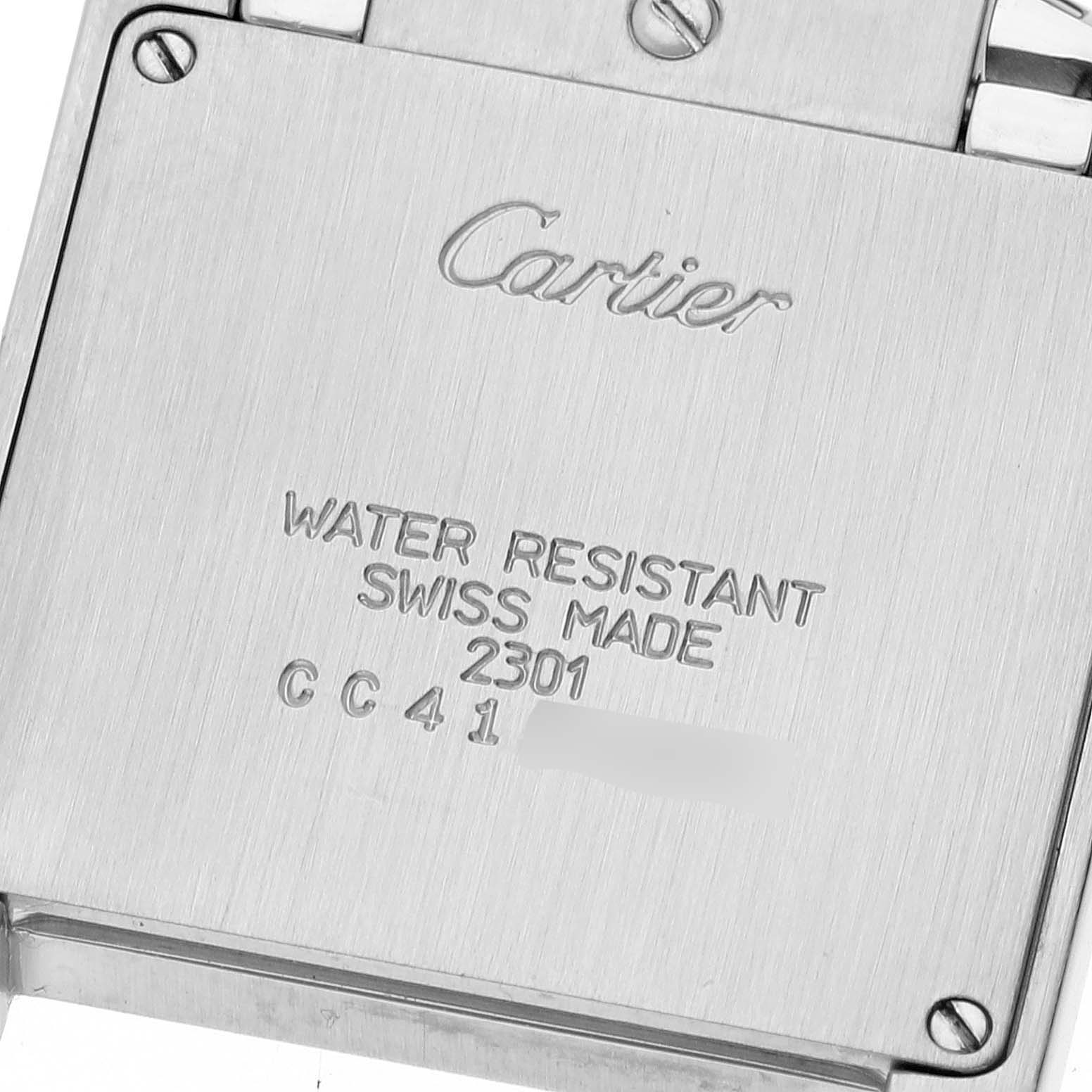 The image shows the back case of a Cartier Tank Française watch, featuring the brand
s engraving and water resistance information.