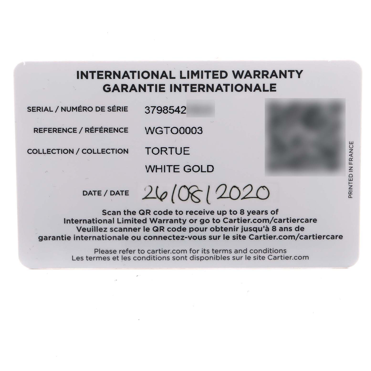 The image shows the warranty card for a Cartier Tortue WGTO0003 Men's White Gold Silver Dial model watch, detailing serial and reference numbers.