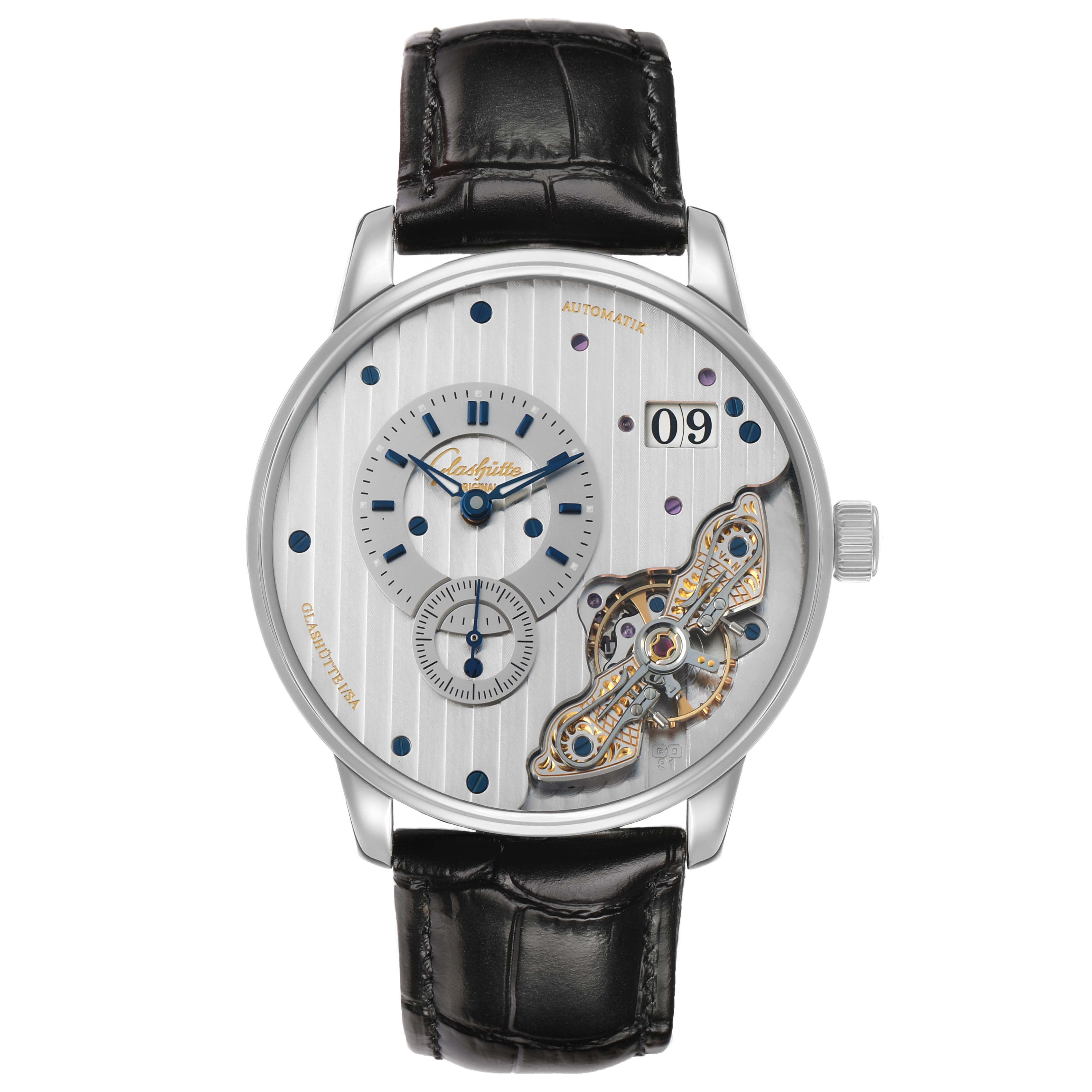 The Glashütte Pano watch is shown from a front angle, highlighting its dial, subdials, and open balance wheel.