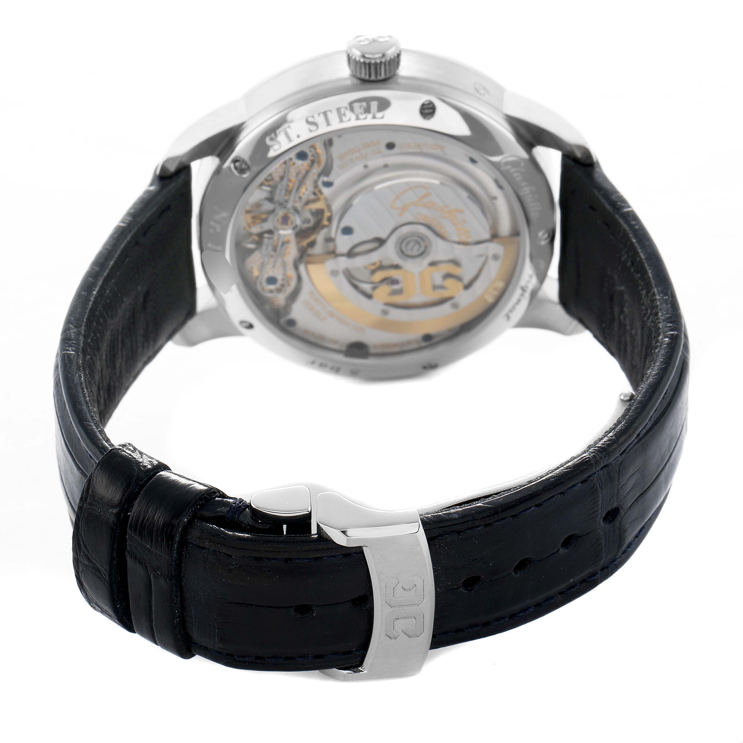 The Glashütte Pano model is shown from the back, highlighting the movement and open caseback, with the strap and clasp visible.