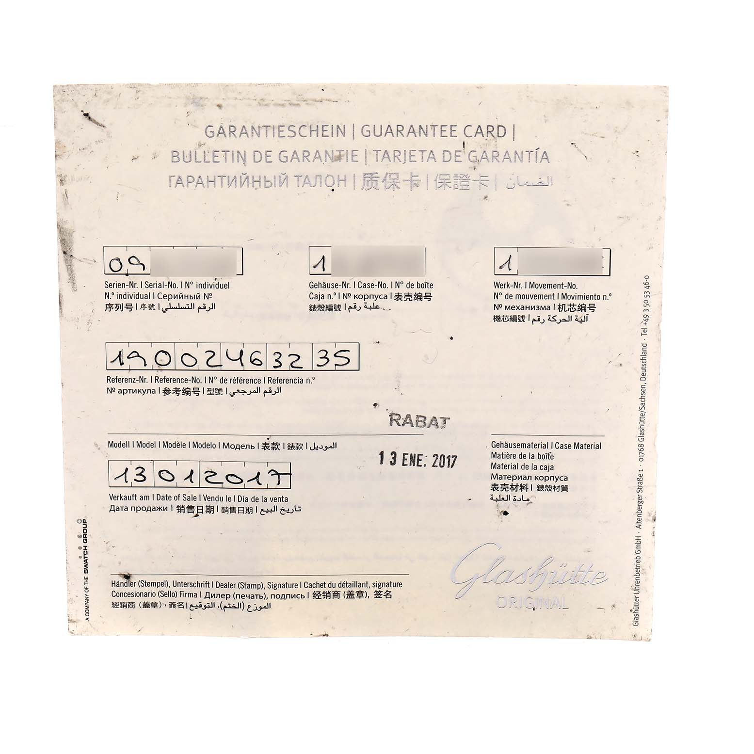 The image shows a Glashütte Pano model guarantee card, viewed from above, displaying serial and model numbers.