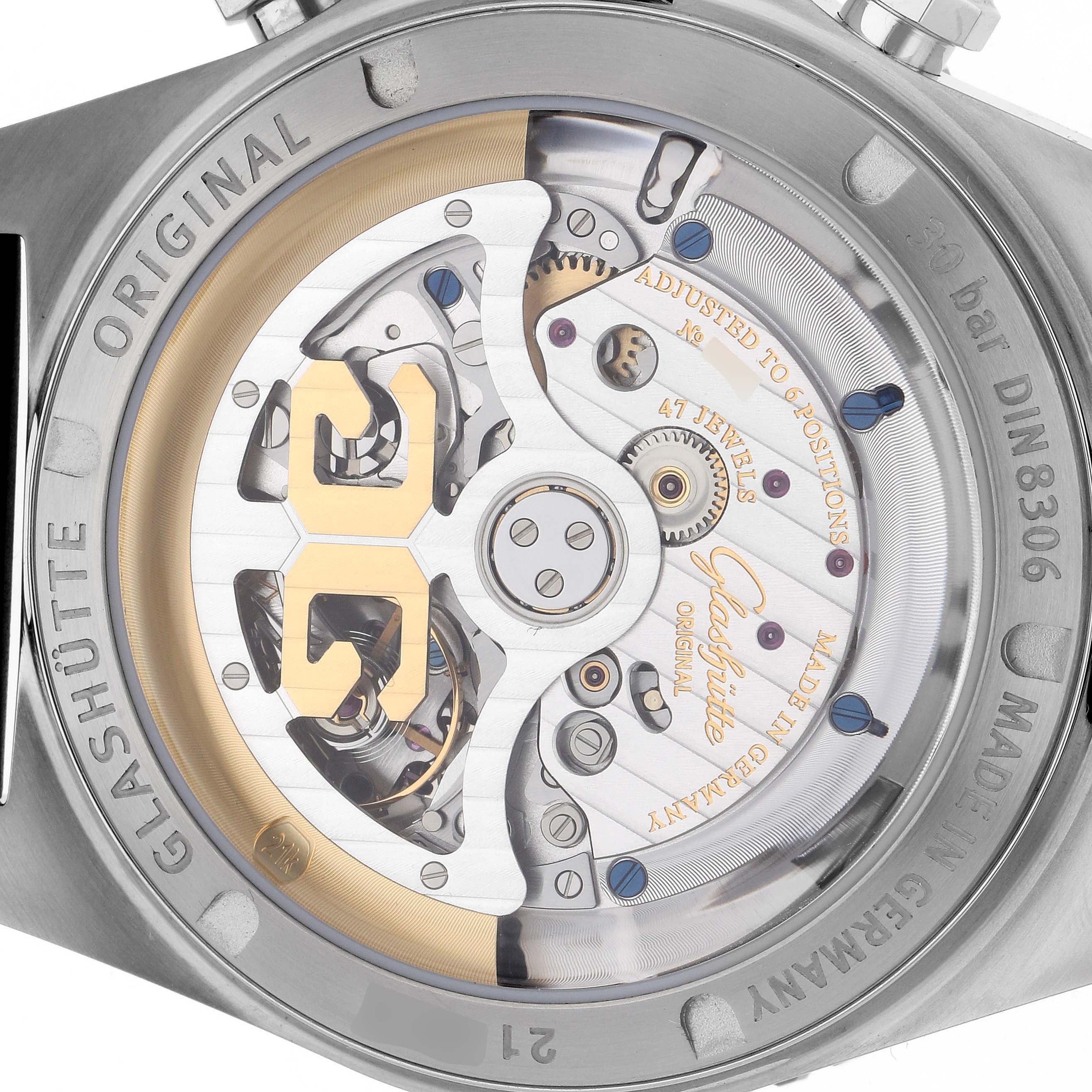 The Glashütte Original watch is shown from the back, revealing its intricate mechanical movement and rotor.