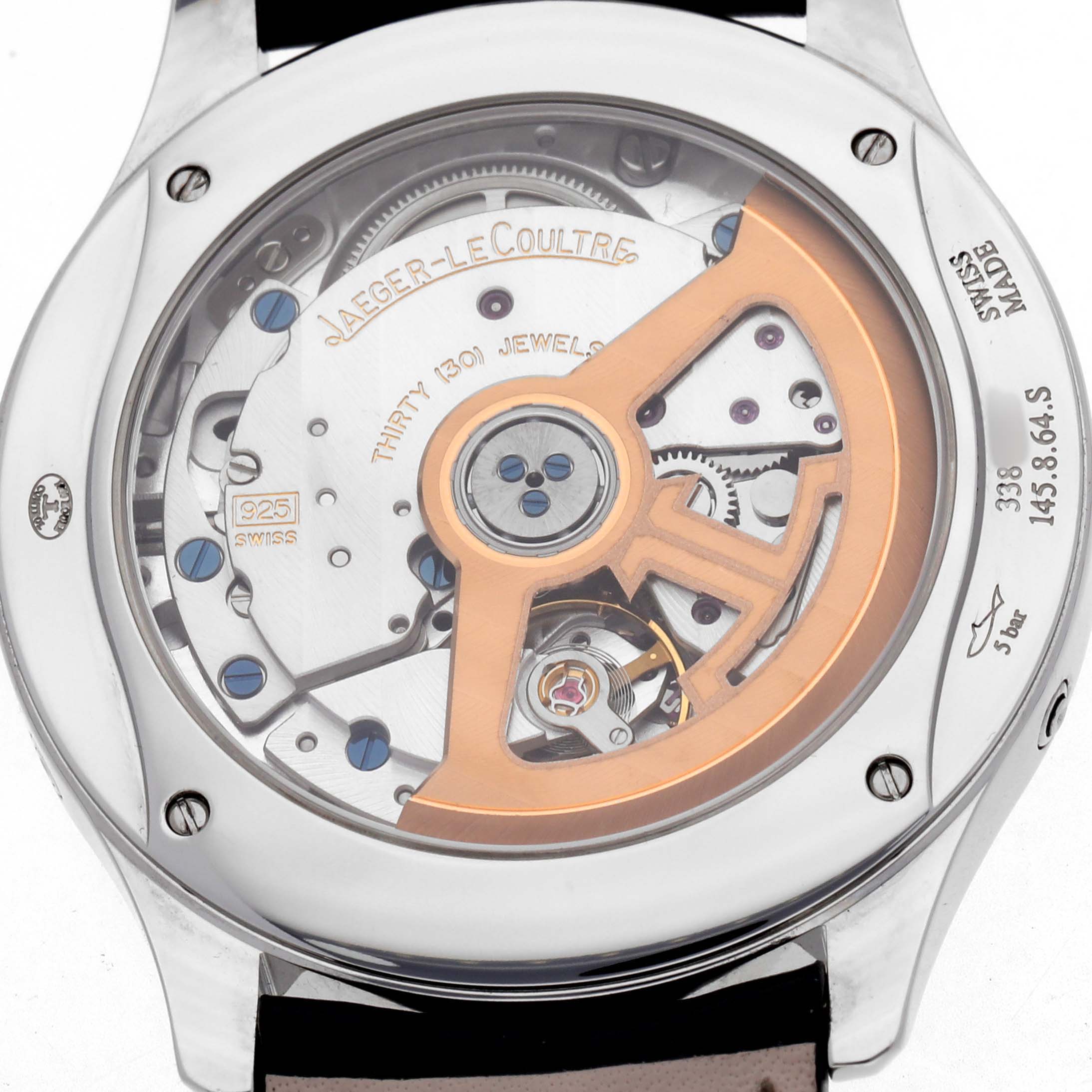 The image shows the back of a Jaeger-LeCoultre Master watch, highlighting its movement and rotor mechanism.