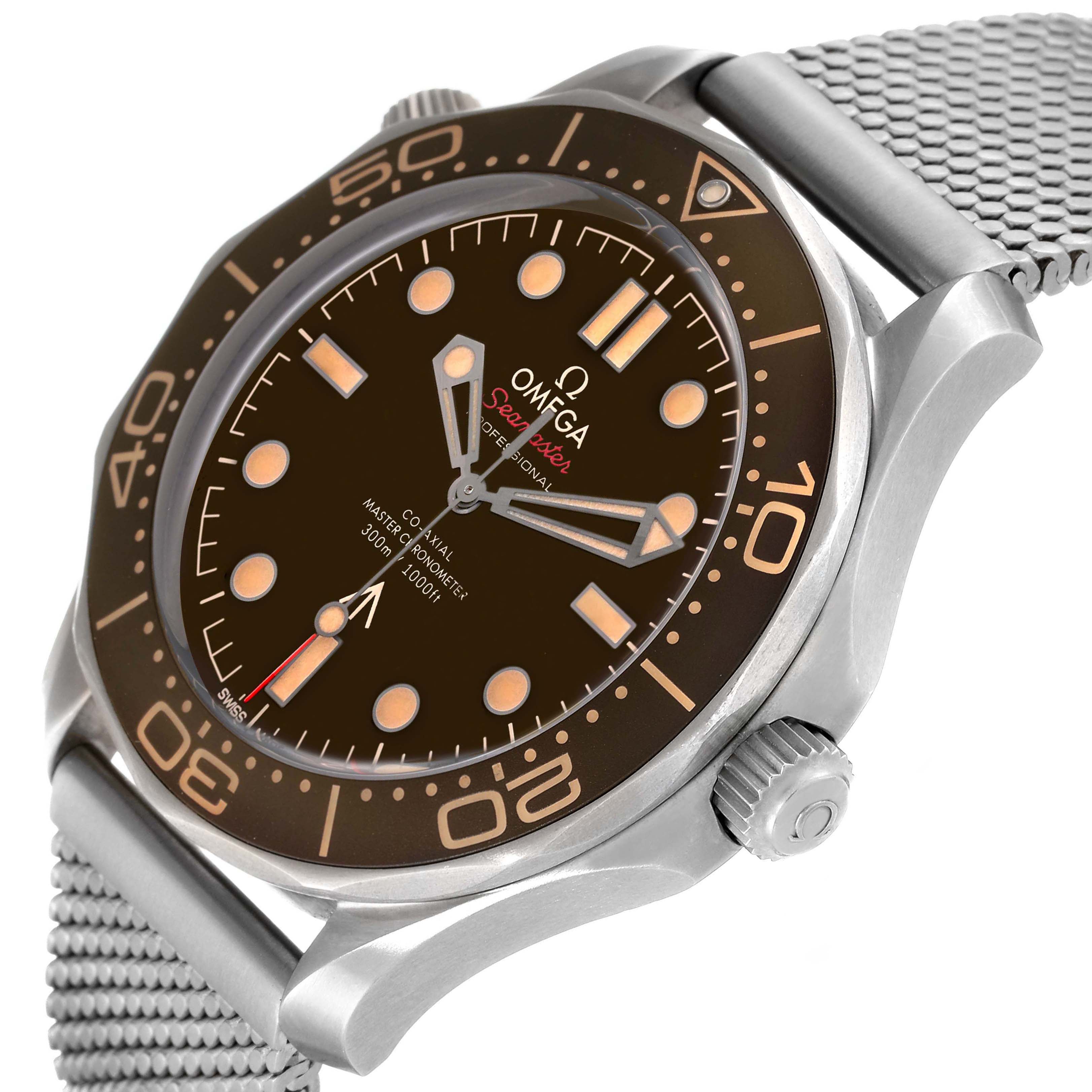 The Omega Seamaster 210.90.42.20.01.001 Men's Titanium Brown Dial 210.90.42.20.01.001 Men's Titanium Brown Dial is shown from an angled side view highlighting the dial, bezel, crown, and stainless steel mesh bracelet.