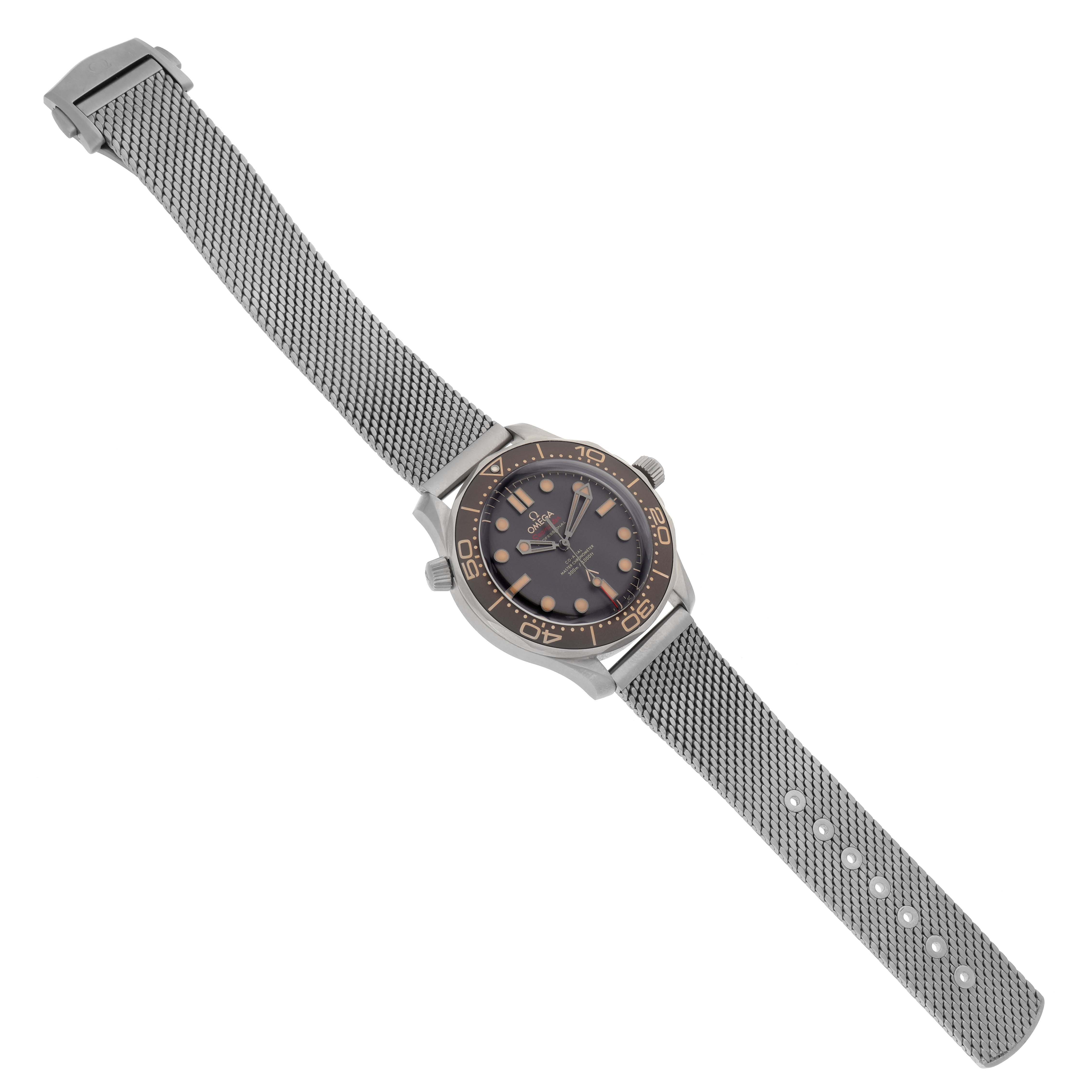 The Omega Seamaster 210.90.42.20.01.001 Men's Titanium Brown Dial 210.90.42.20.01.001 Men's Titanium Brown Dial watch is shown at a three-quarter angle with its dial, bezel, case, and mesh bracelet visible.