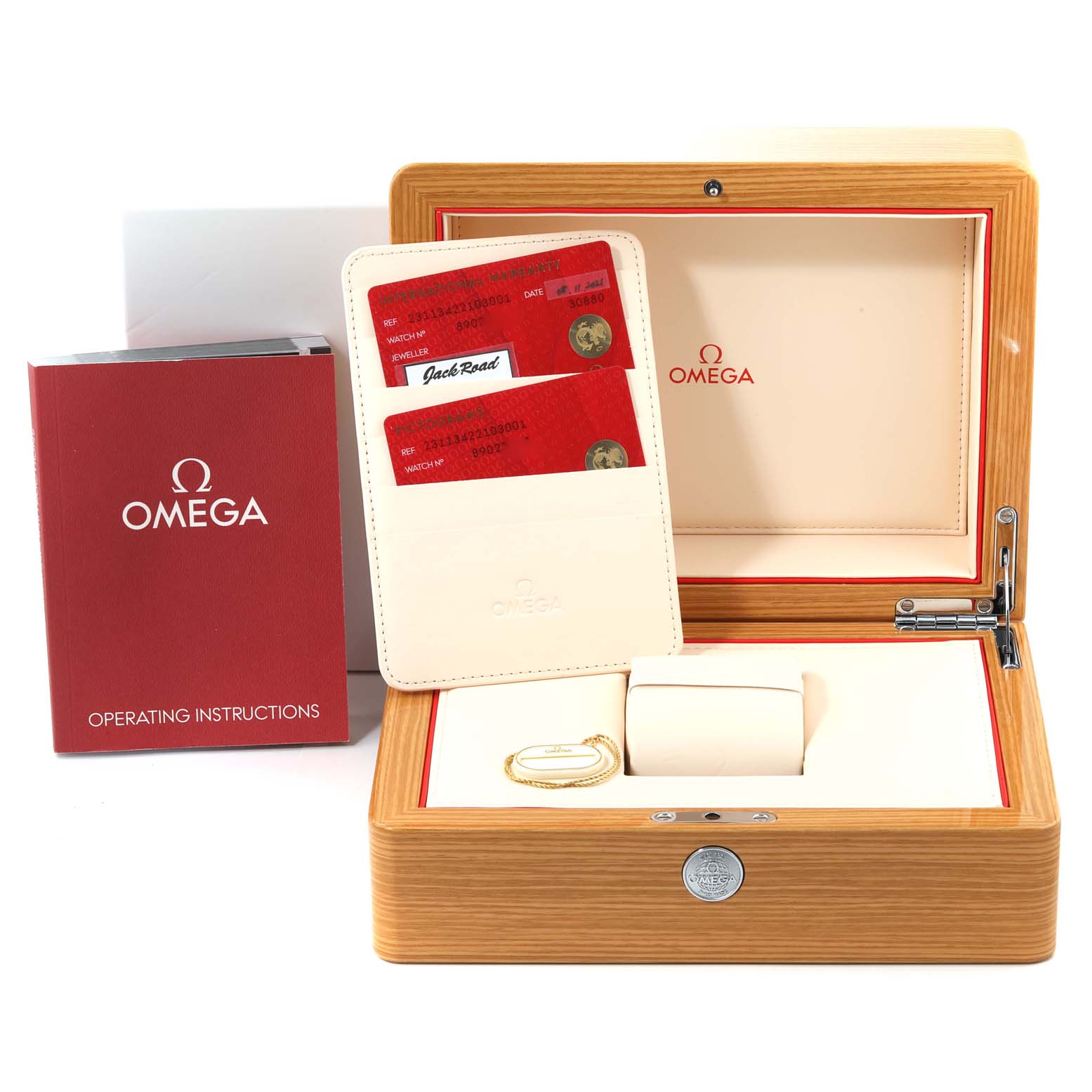 The image shows the packaging and accessories for the Omega Aqua Terra 231.13.42.21.03.001 Men
s Stainless Steel Blue Dial 231.13.42.21.03.001 Men
s Stainless Steel Blue Dial watch, including the operating instructions, warranty cards, and the watch box.