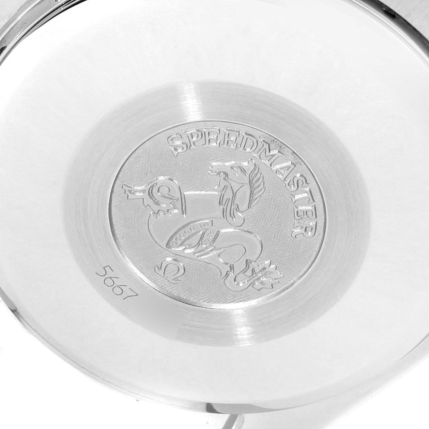 The image shows the backside case of the Omega Speedmaster 3311.20.00 Men's Steel and Gold (two tone) Silver Dial 3311.20.00 Men's Steel and Gold (two tone) Silver Dial watch, highlighting its engraved logo and serial number.