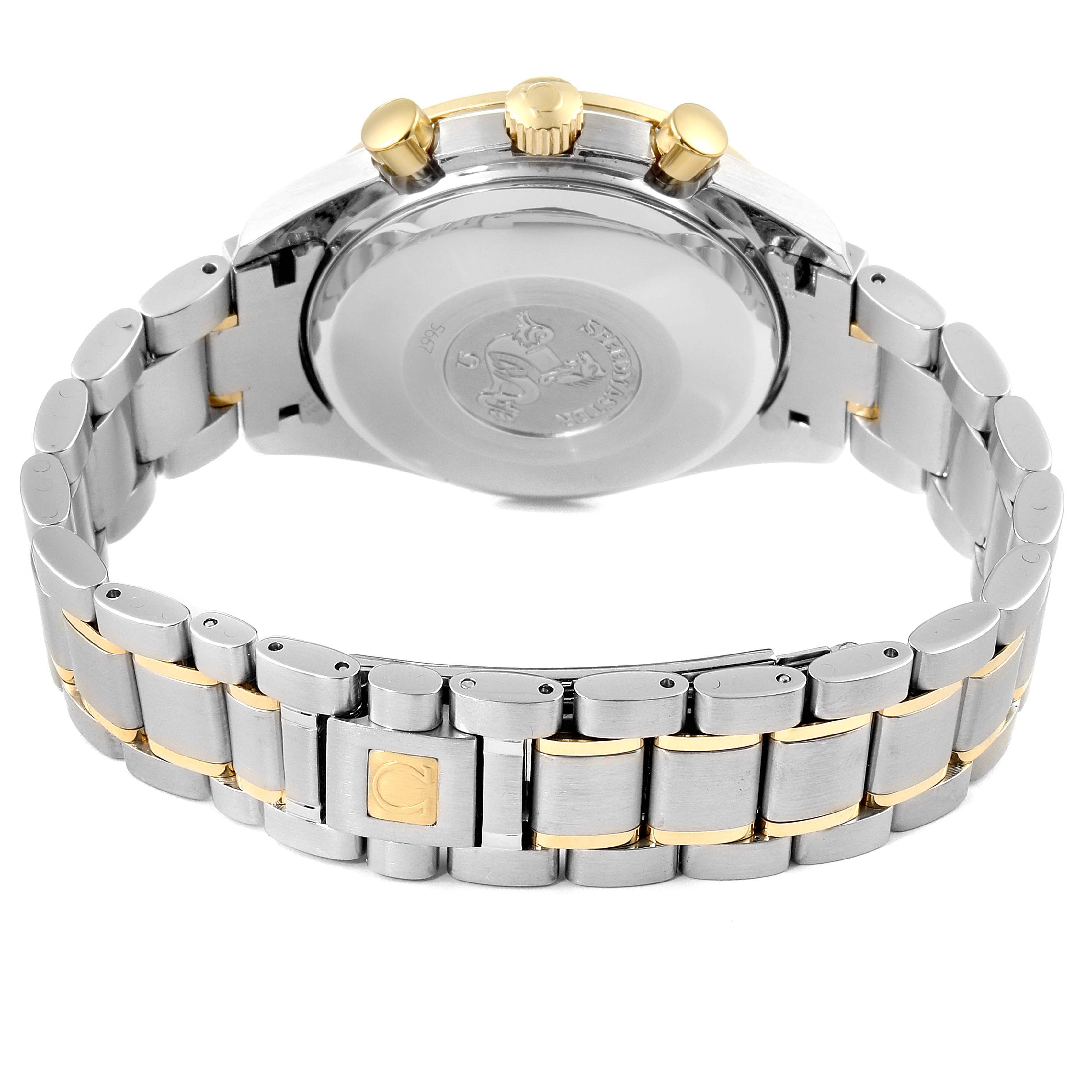 The image shows the backside of an Omega Speedmaster 3311.20.00 Men's Steel and Gold (two tone) Silver Dial 3311.20.00 Men's Steel and Gold (two tone) Silver Dial watch, including its metal bracelet and clasp.