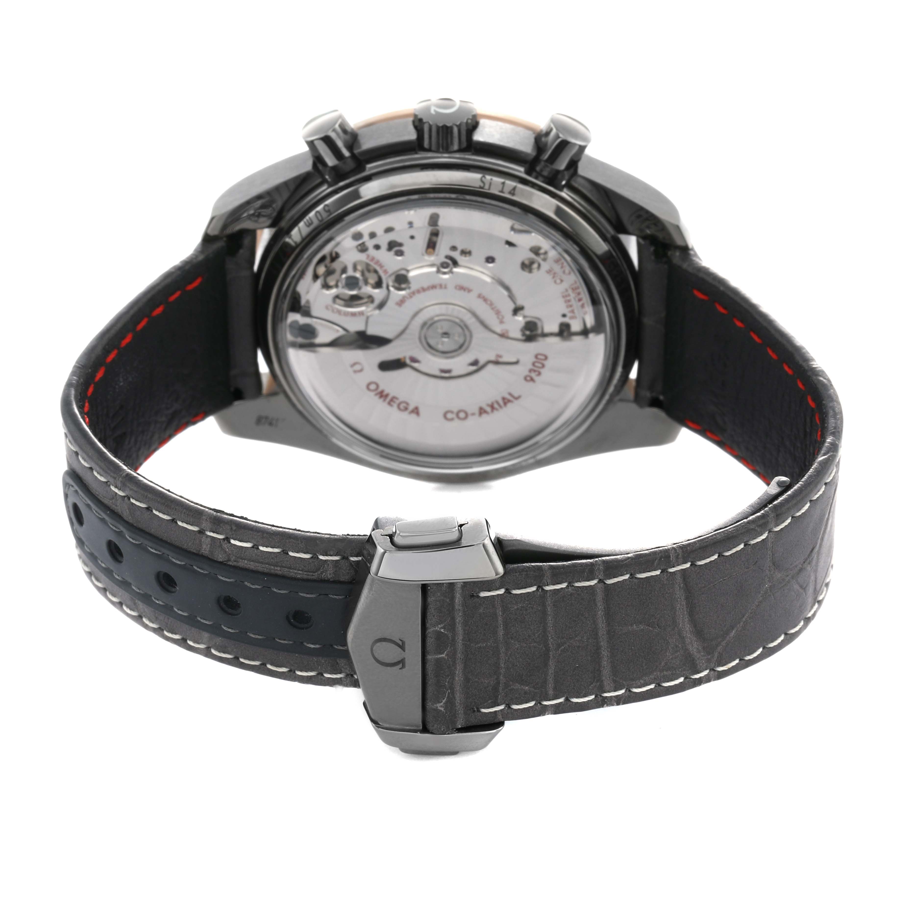 The image shows the back view of an Omega Speedmaster 311.63.44.51.99.001 Men's Ceramic Grey Dial, highlighting the transparent case back and movement, with the strap clasp visible.