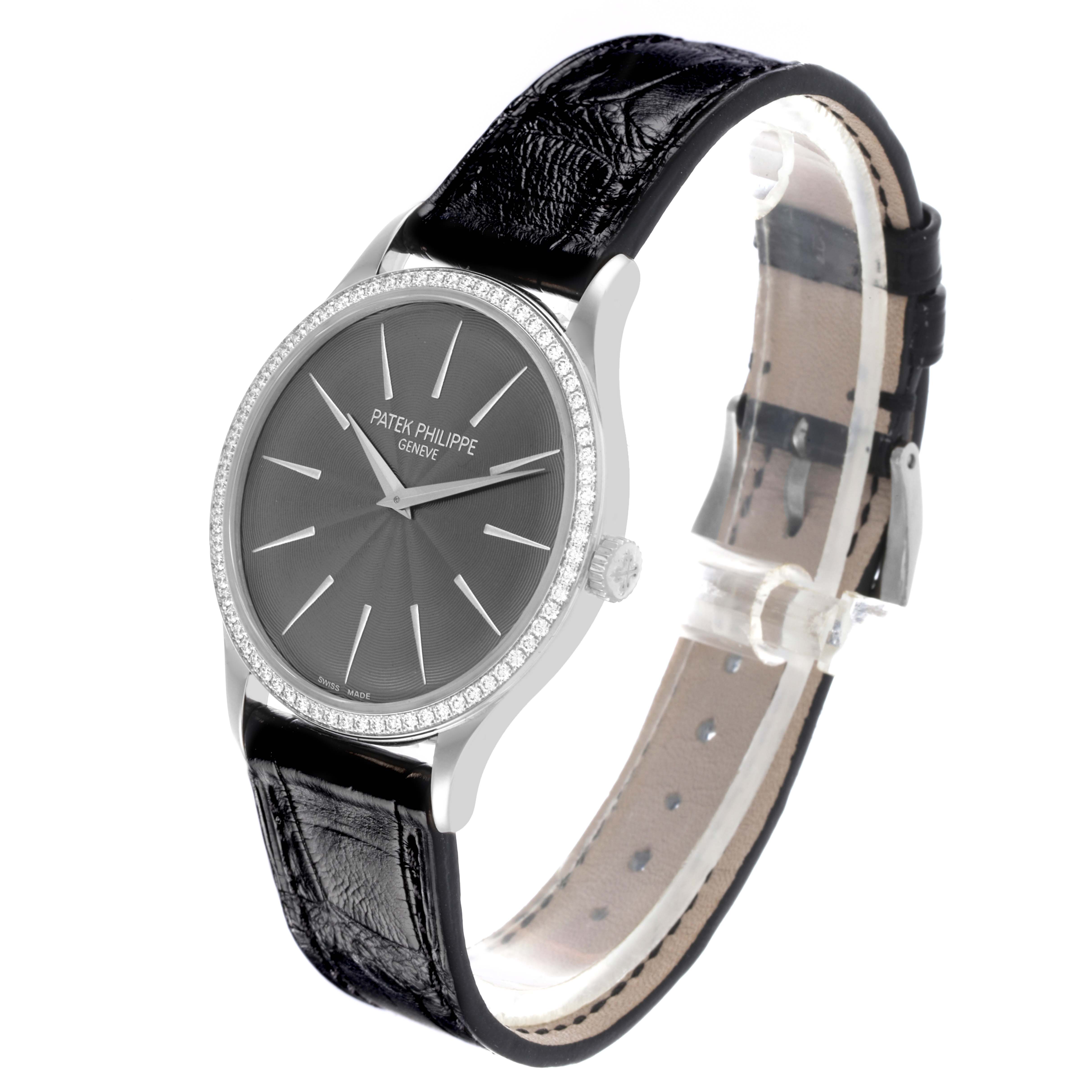 The Patek Philippe Calatrava 4897G-010 Women's White Gold Grey Dial 4897G-010 Women's White Gold Grey Dial watch is shown at a three-quarter angle, highlighting the face, bezel, and leather strap.