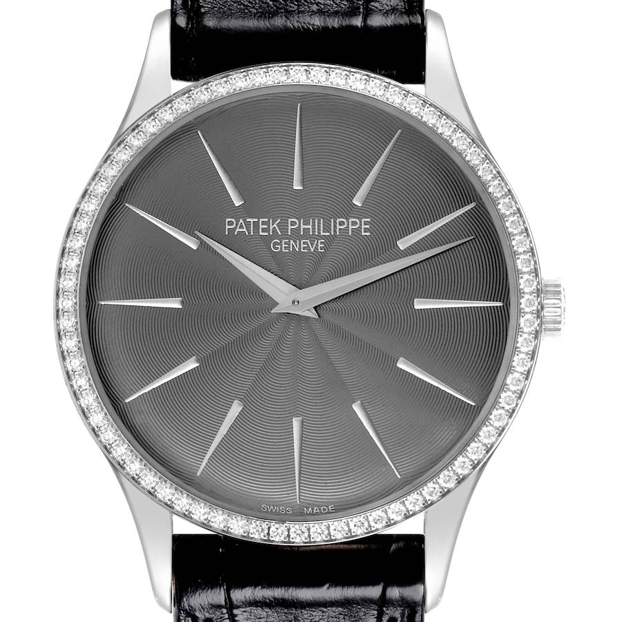 The Patek Philippe Calatrava watch is shown from a front angle, highlighting the dial, diamond bezel, and case.