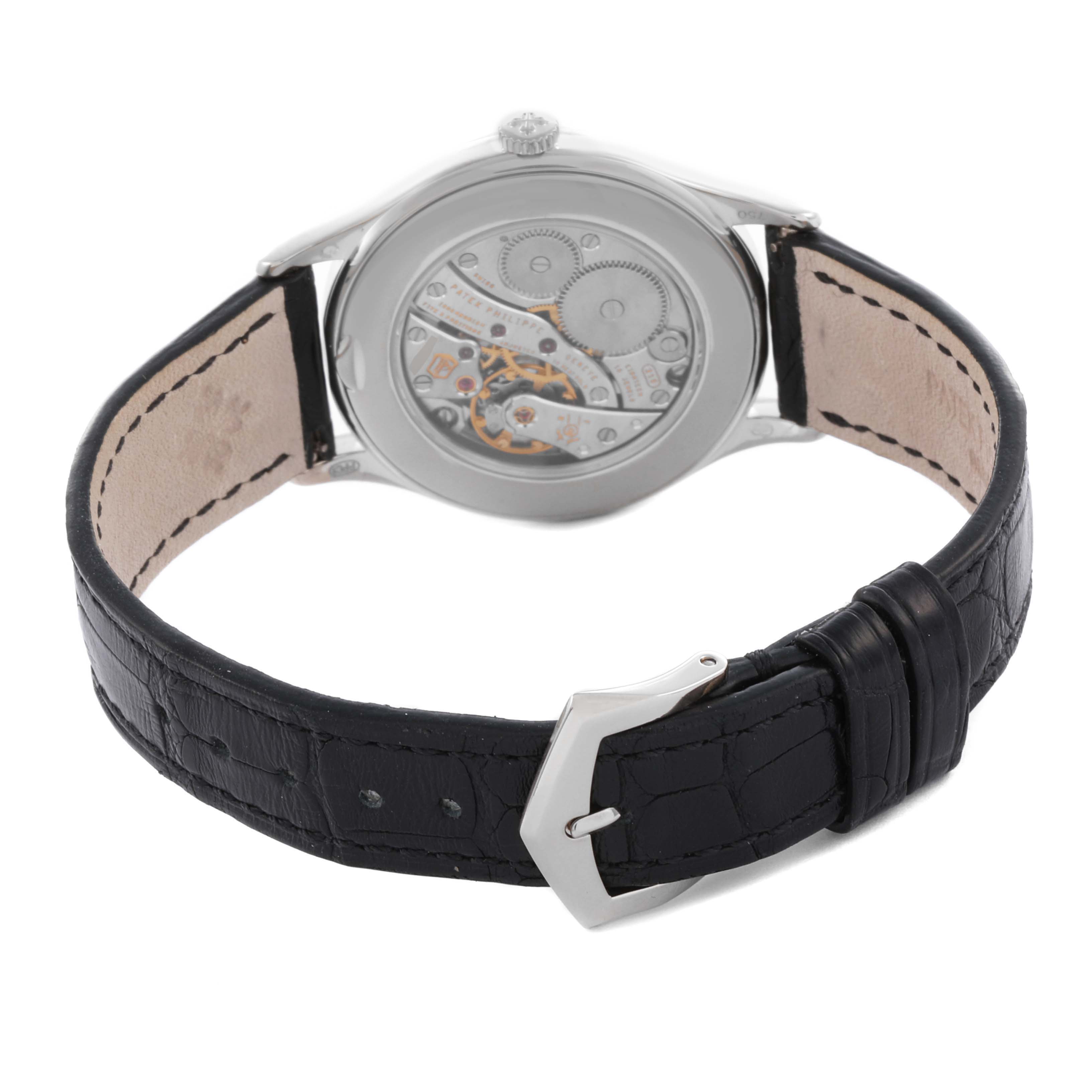 The image shows the back angle of a Patek Philippe Calatrava 4897G-010 Women's White Gold Grey Dial 4897G-010 Women's White Gold Grey Dial watch, displaying the movement and leather strap with a buckle.