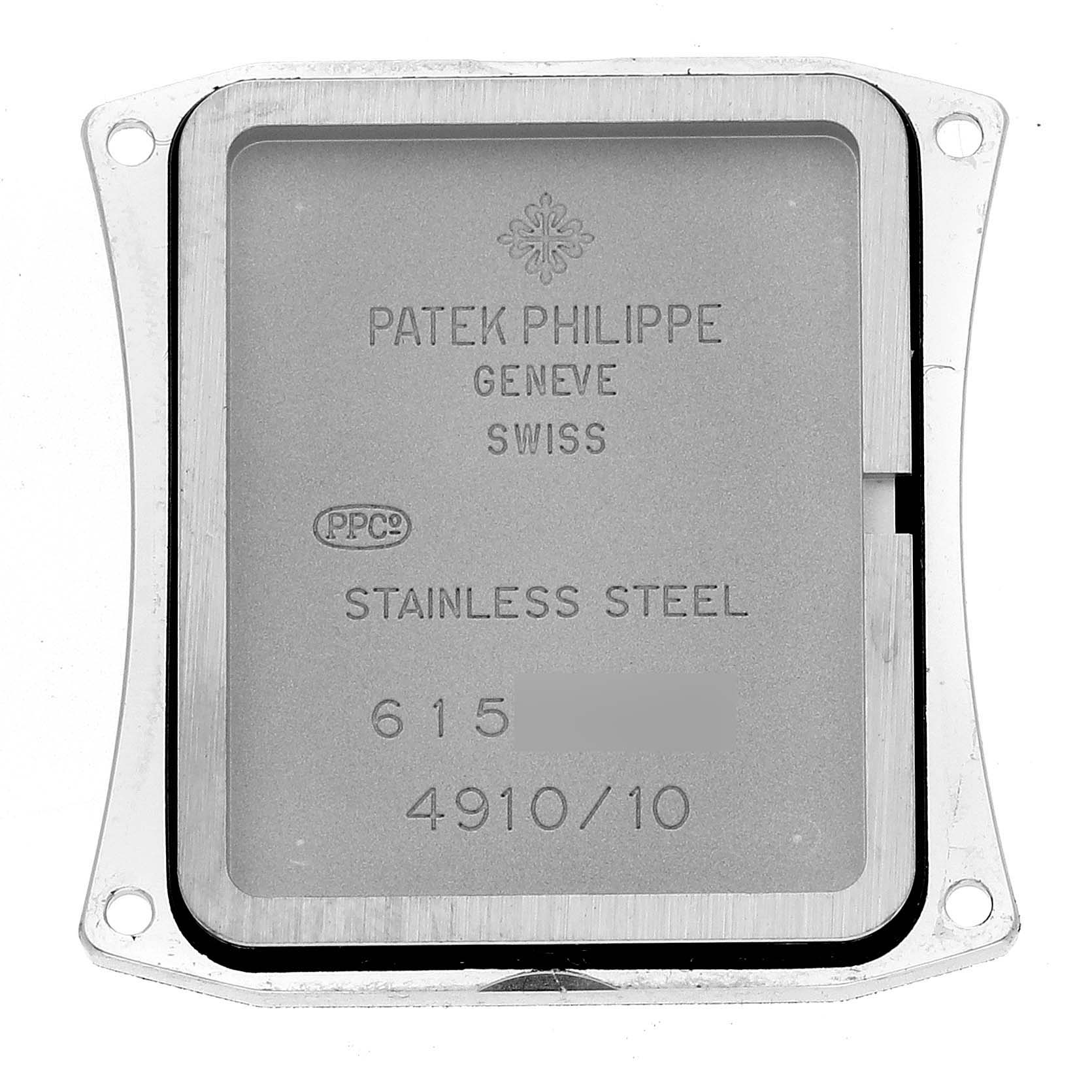 The image shows the back cover of a Patek Philippe Twenty-4 4910/10 Women's Stainless Steel Blue Dial 4910/10 Women's Stainless Steel Blue Dial watch, highlighting its engravings and stainless steel material.