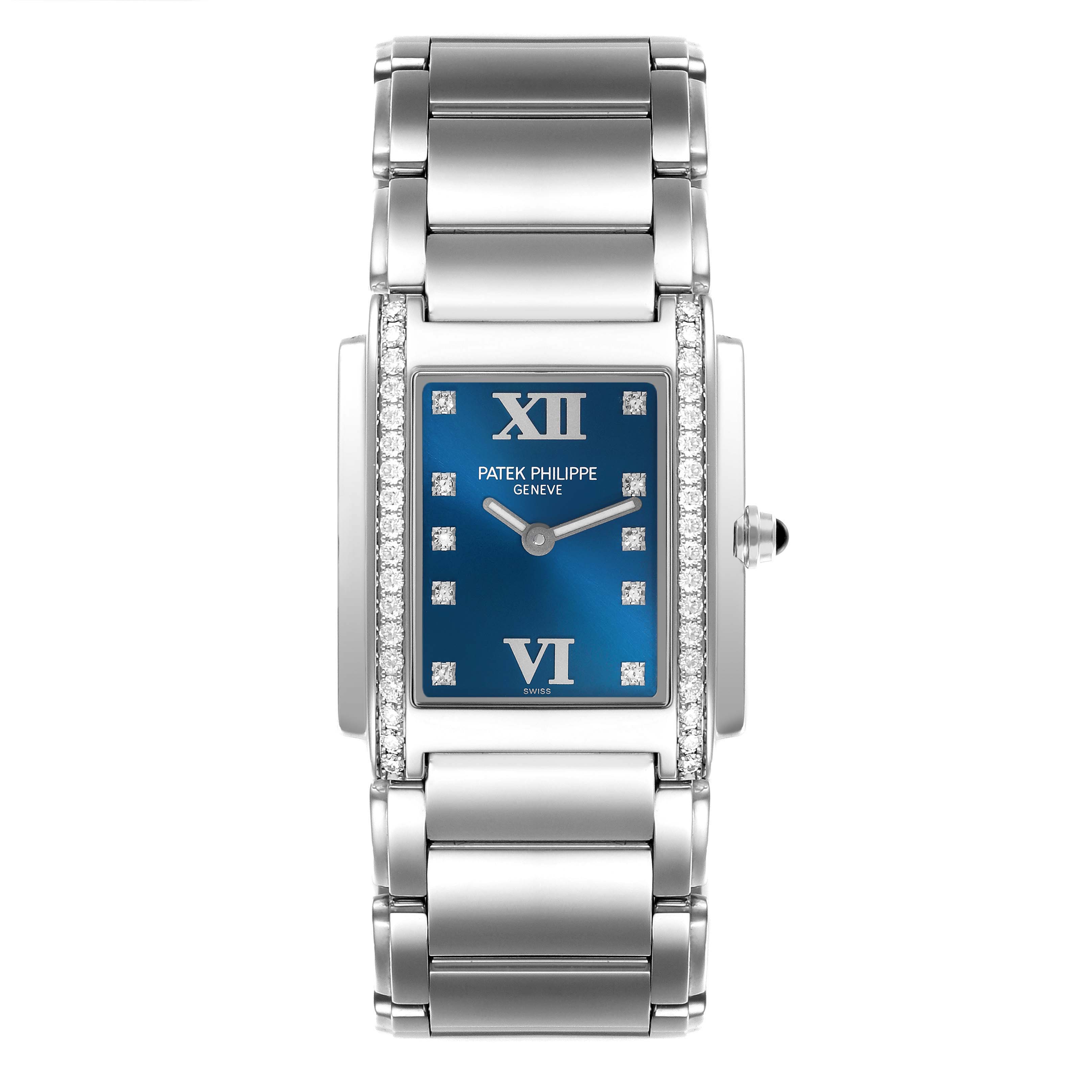 The Patek Philippe Twenty-4 4910/10 Women's Stainless Steel Blue Dial 4910/10 Women's Stainless Steel Blue Dial watch is shown from a top-down angle, highlighting the blue dial, diamond markers, and metal bracelet.