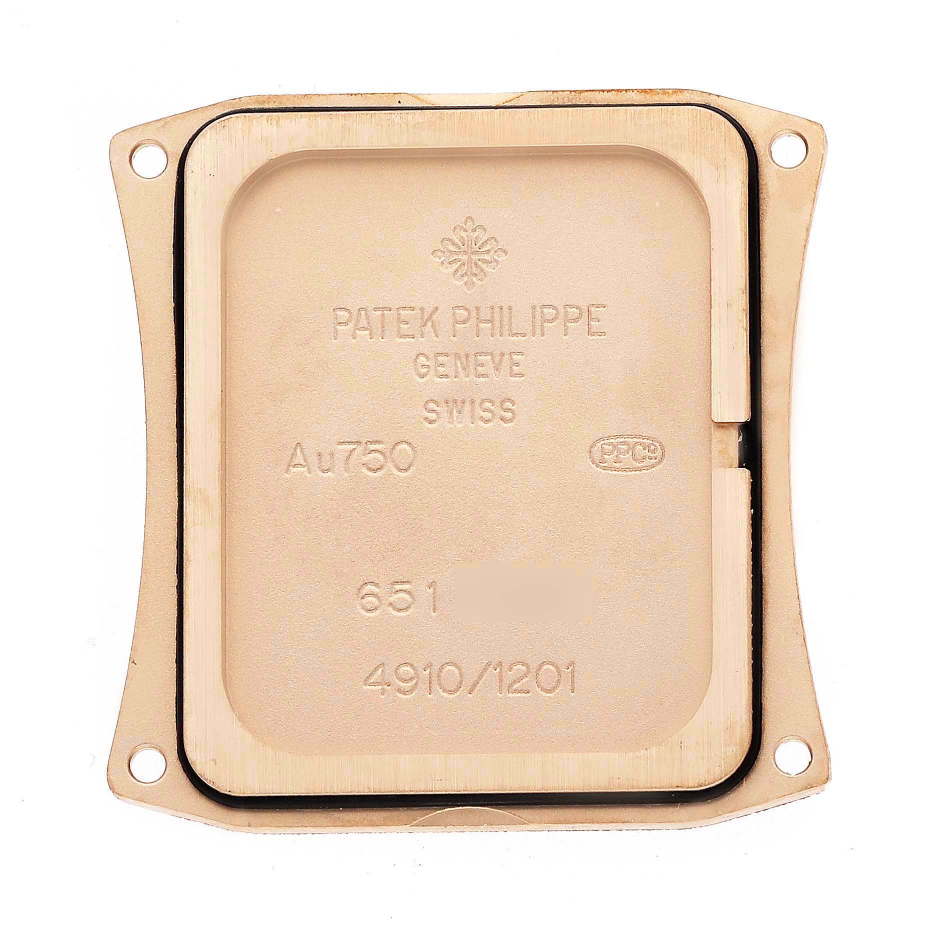 This image shows the back cover of the Patek Philippe Twenty-4 4910/1201R-001 Women's Rose Gold Brown Dial watch, featuring engravings and a seal.