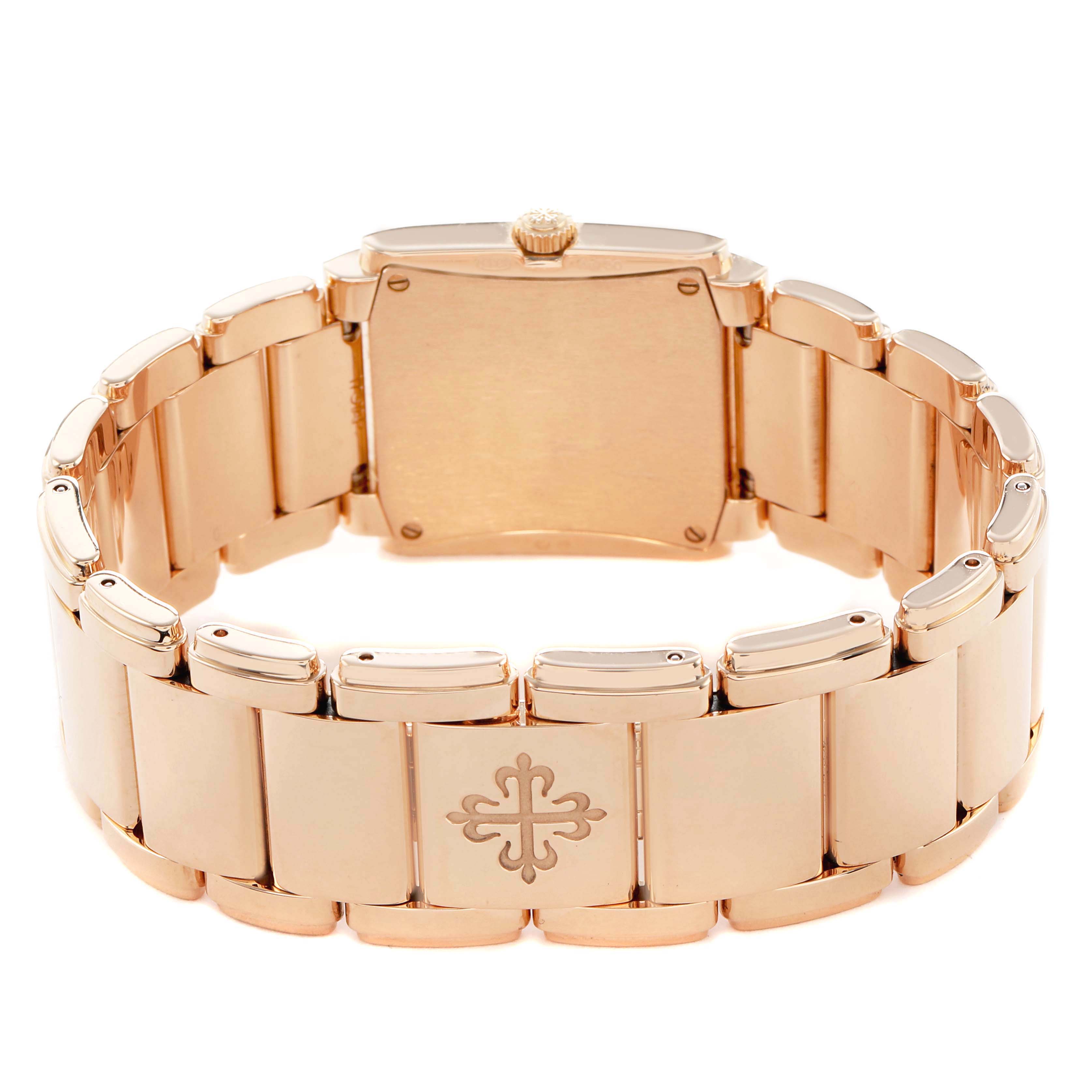 The image shows the back and bracelet of the Patek Philippe Twenty-4 4910/1201R-001 Women's Rose Gold Brown Dial watch from a rear angle, highlighting the clasp and crown.