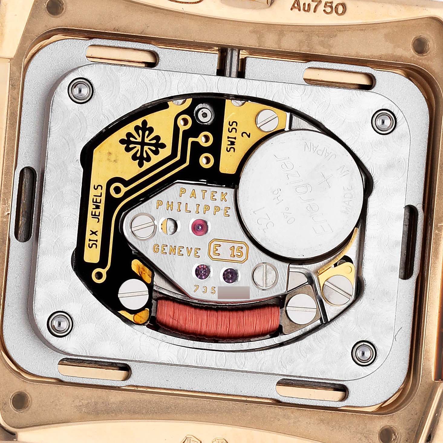 The image shows the movement of a Patek Philippe Twenty-4 4910/1201R-001 Women's Rose Gold Brown Dial watch, focusing on the intricate internal components.