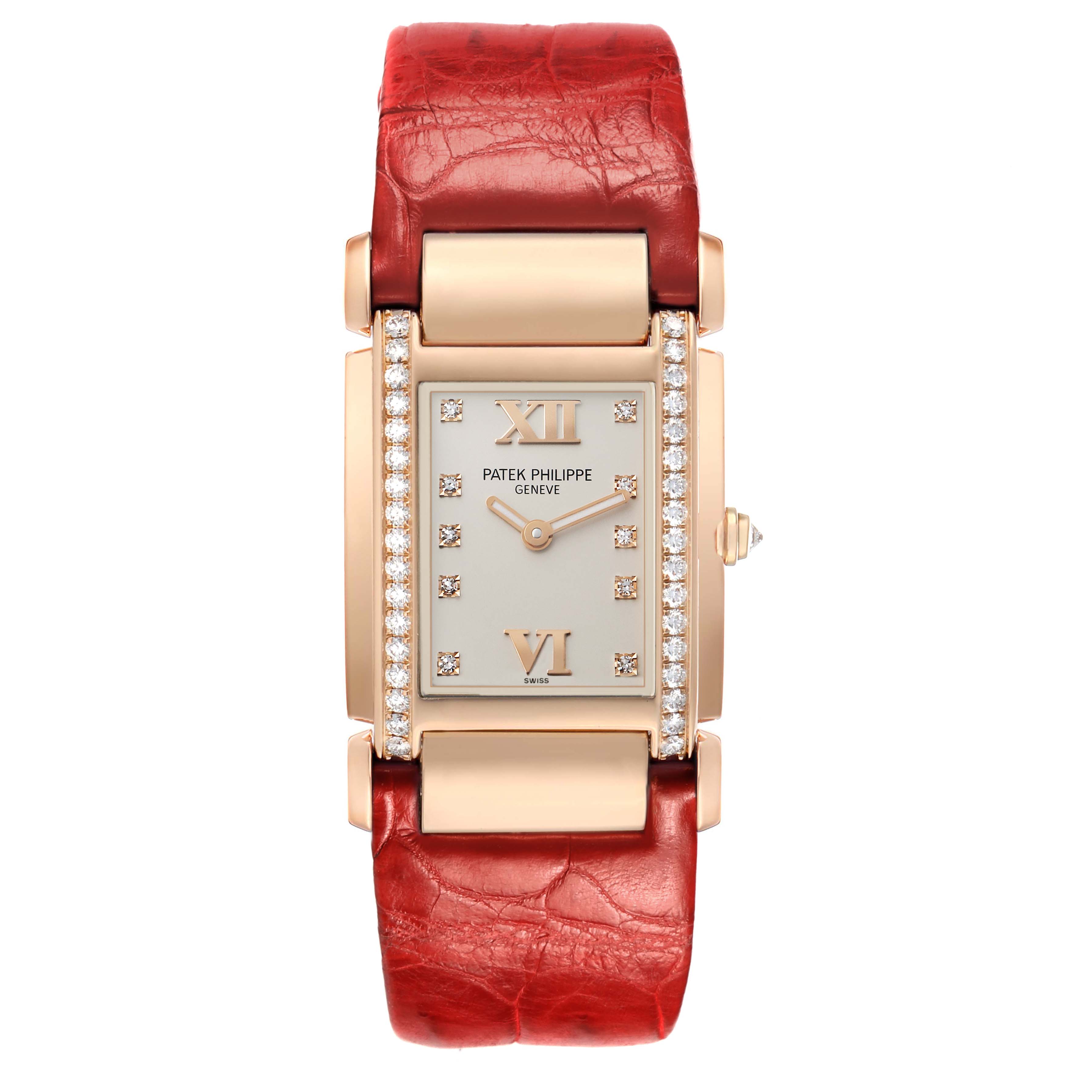 The Patek Philippe Twenty-4 4920R-010 Women's Rose Gold Silver Dial watch is shown from a top-down angle, highlighting its rectangular face, diamond accents, and red strap.