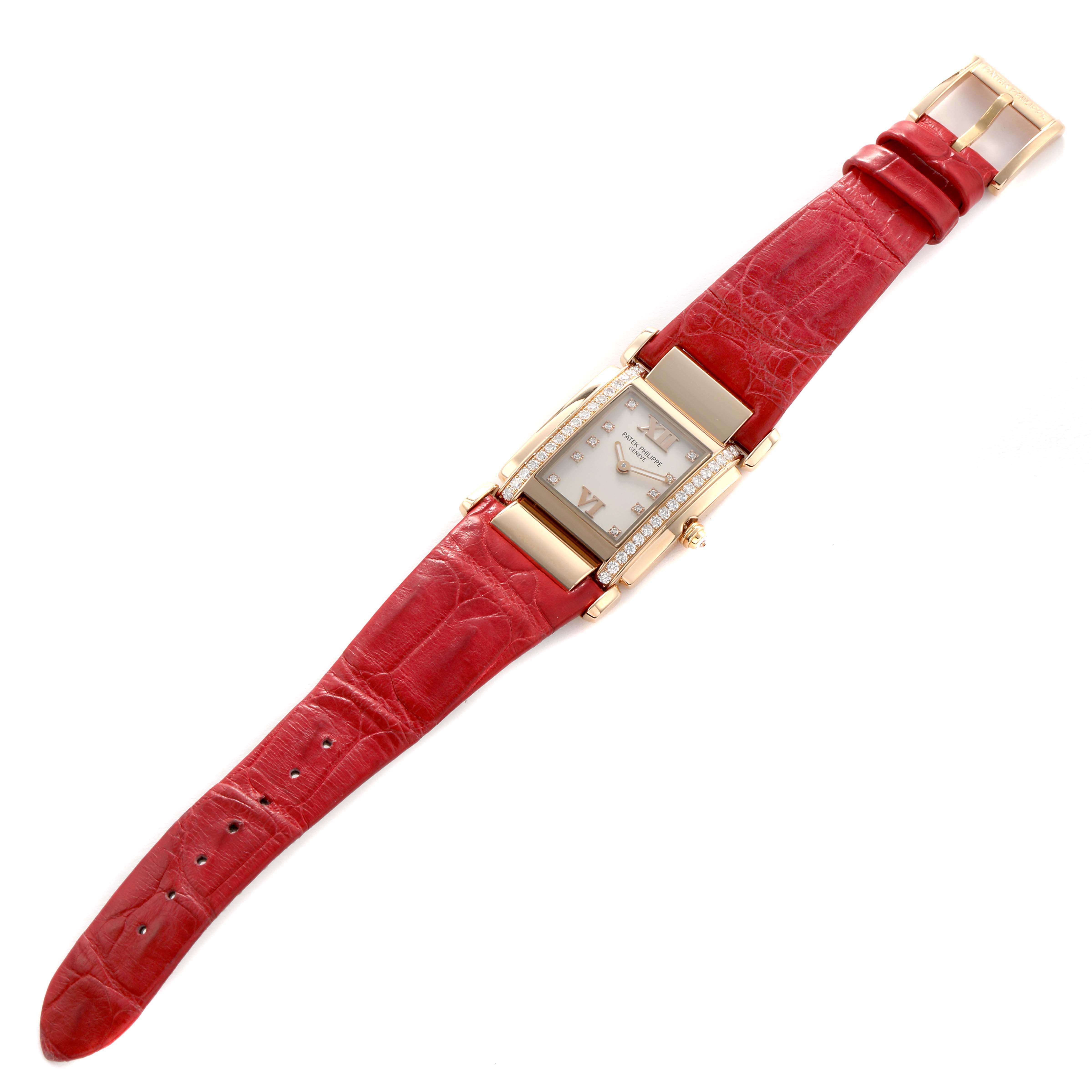 The Patek Philippe Twenty-4 4920R-010 Women's Rose Gold Silver Dial watch is shown from a top view, displaying the full watch with a red leather strap and a diamond-set case.