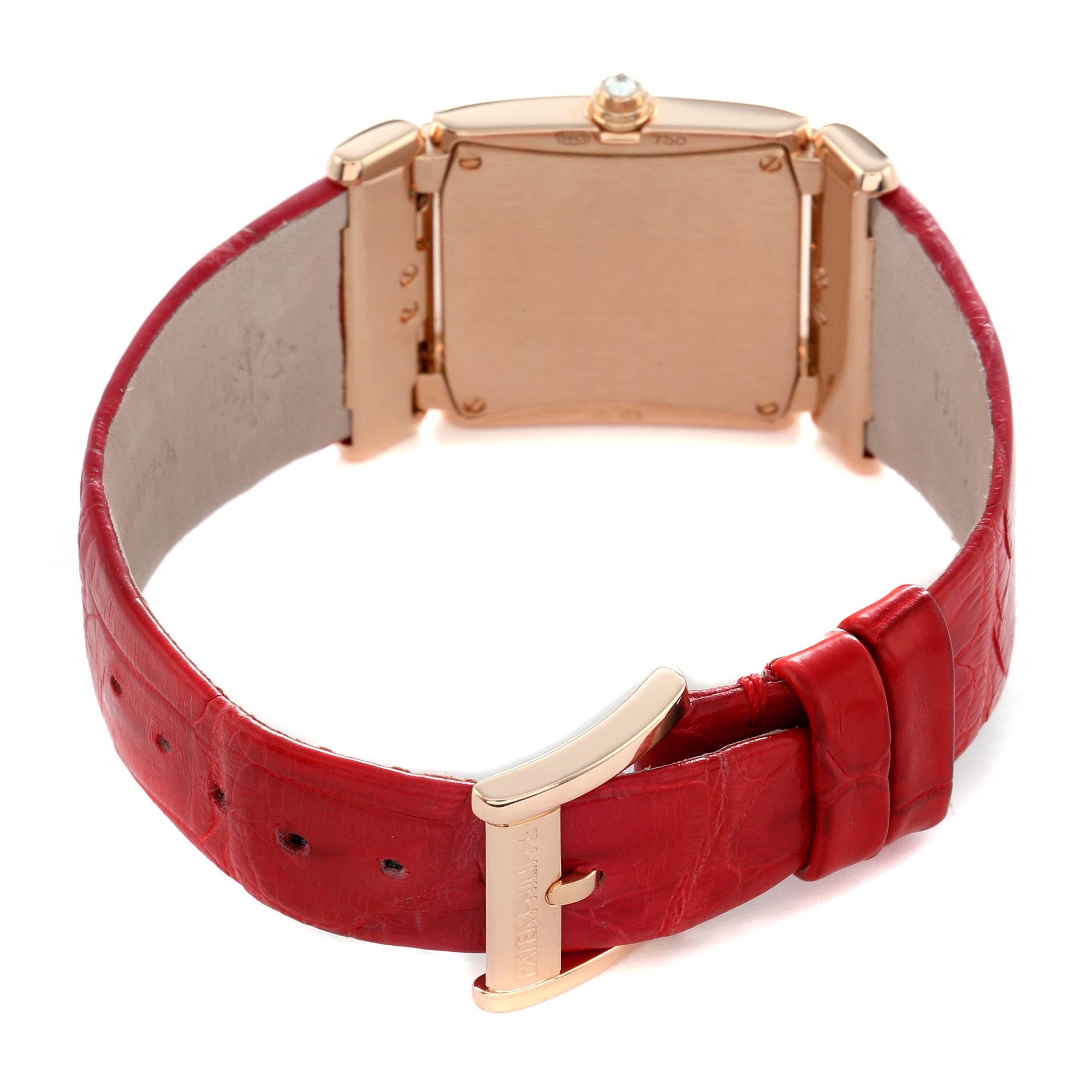 The image shows the back view of a Patek Philippe Twenty-4 4920R-010 Women's Rose Gold Silver Dial watch, highlighting its red strap and clasp.