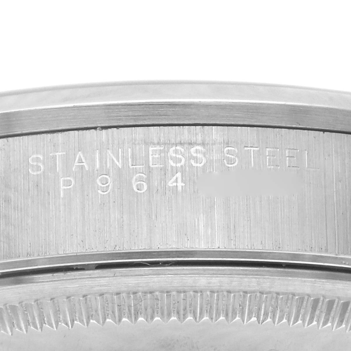 The image shows a close-up view of the stainless steel bezel of a Rolex Air-King 14000M Men's Stainless Steel Pink Dial 14000M Men's Stainless Steel Pink Dial watch, highlighting its engraved details.