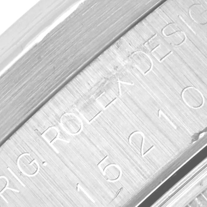 The image shows an engraved part of the case side of a Rolex Date 15210 Men
s Stainless Steel Black Dial 15210 Men
s Stainless Steel Black Dial watch.