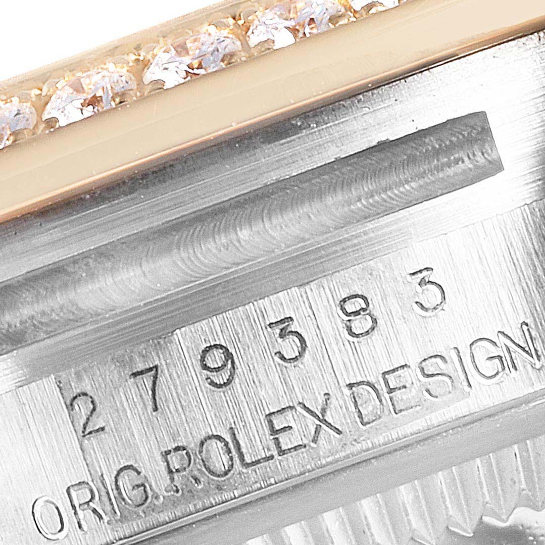 This image shows a close-up of the engraved reference number and part of the diamond-set bezel on a Rolex Datejust 279383 Women's Steel and Gold (two tone) Green Dial 279383 Women's Steel and Gold (two tone) Green Dial watch.