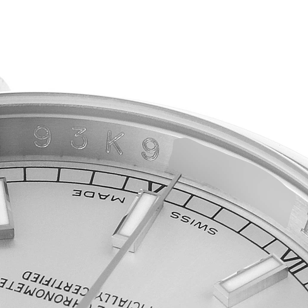 The close-up angle shows the detailed markings and a couple of hour markers on the dial of the Rolex Datejust 116200 Men's Stainless Steel Silver Dial 116200 Men's Stainless Steel Silver Dial watch.