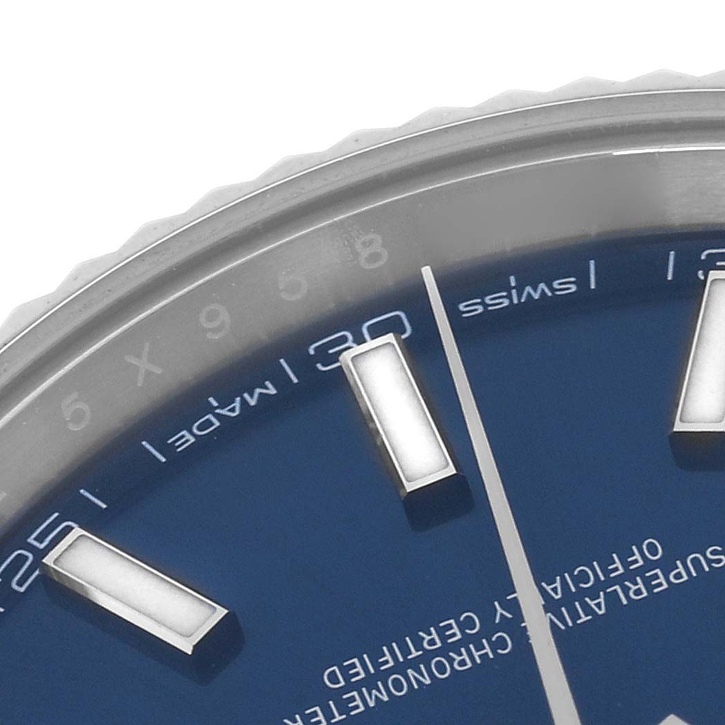 The image shows a close-up of the dial and markers of the Rolex Datejust 41 126334 Men's Stainless Steel Blue Dial 126334 Men's Stainless Steel Blue Dial, focusing on the edge with hour markers.