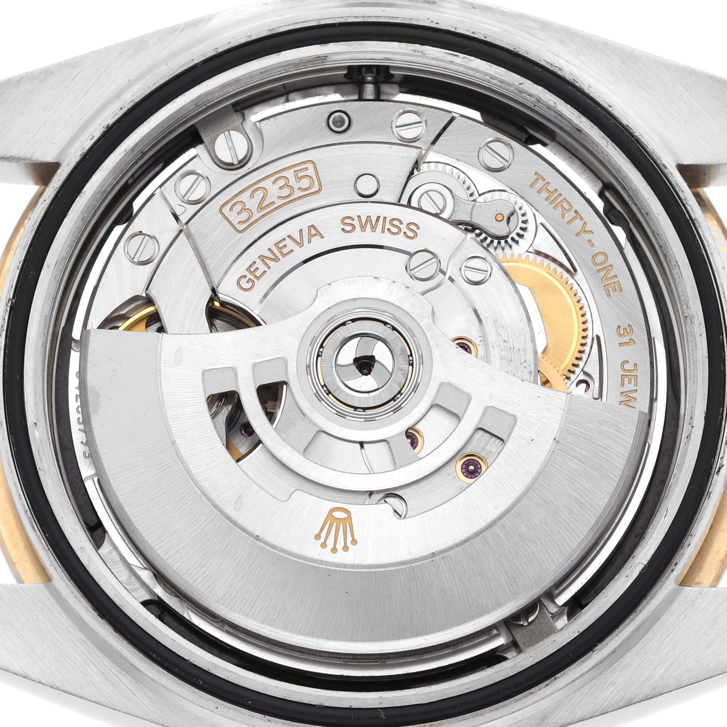 The image shows the movement of a Rolex Datejust 41 126333 Men's Steel and Gold (two tone) Black Dial, focusing on its automatic rotor and intricate components.