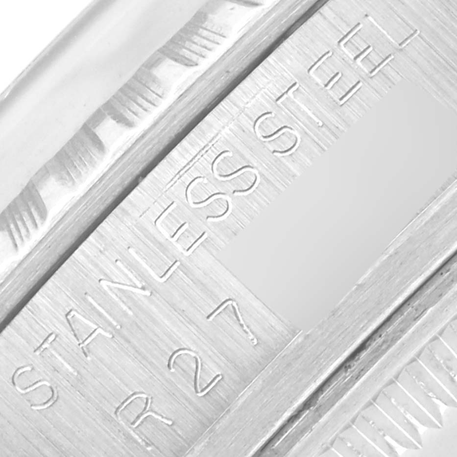 The image shows a close-up of the stainless steel engraving on the side of the Rolex Vintage Collection 16030 Men's Stainless Steel Silver Dial 16030 Men's Stainless Steel Silver Dial watch.