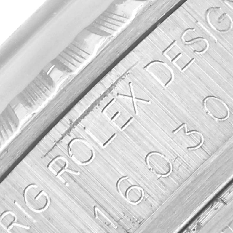 The image shows a close-up of the engraved side of the bezel and case, displaying "Rolex Design 16030" on the Vintage Collection model by Rolex.