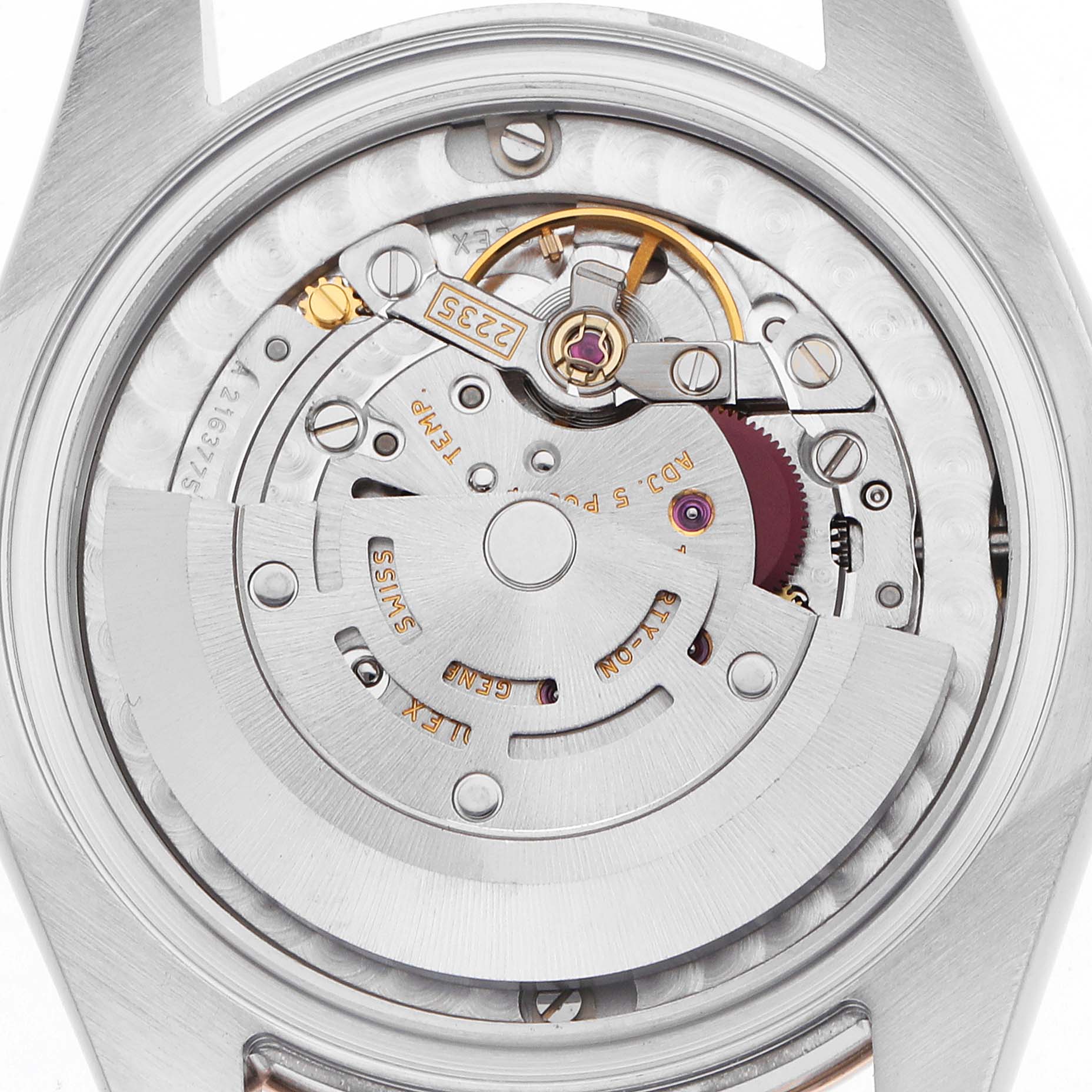 The image shows the movement of a Mid-Size Rolex watch from a top-down angle, highlighting the rotor and mechanical components.