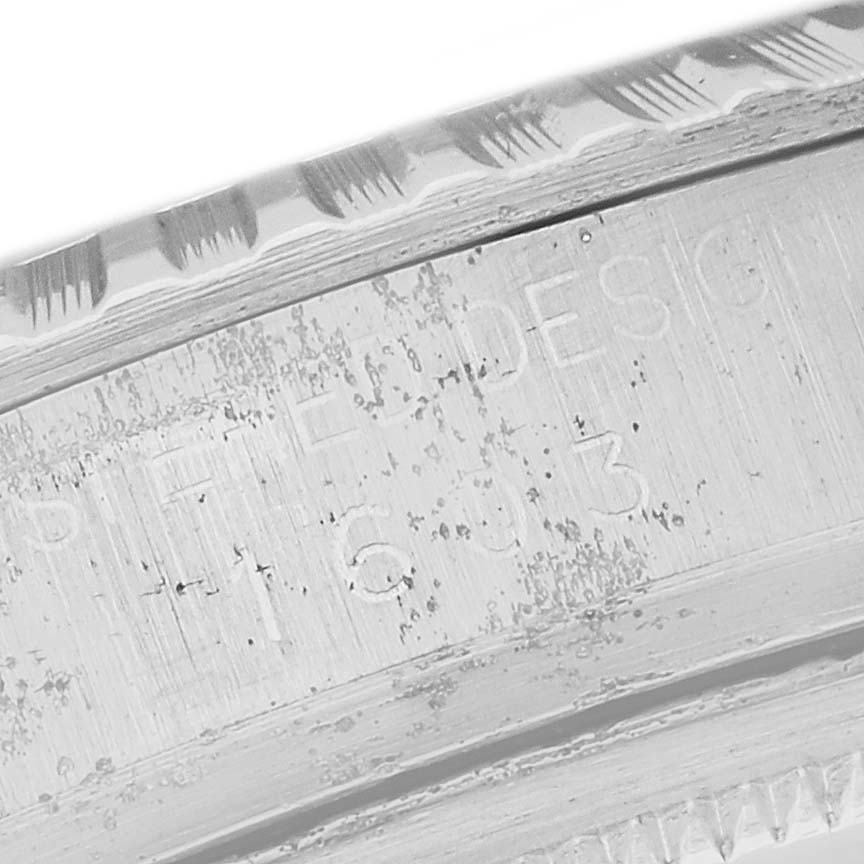 This image shows a close-up of the edge and engraving detail on a Rolex Vintage Collection 1603 Men's Stainless Steel Silver Dial 1603 Men's Stainless Steel Silver Dial watch.