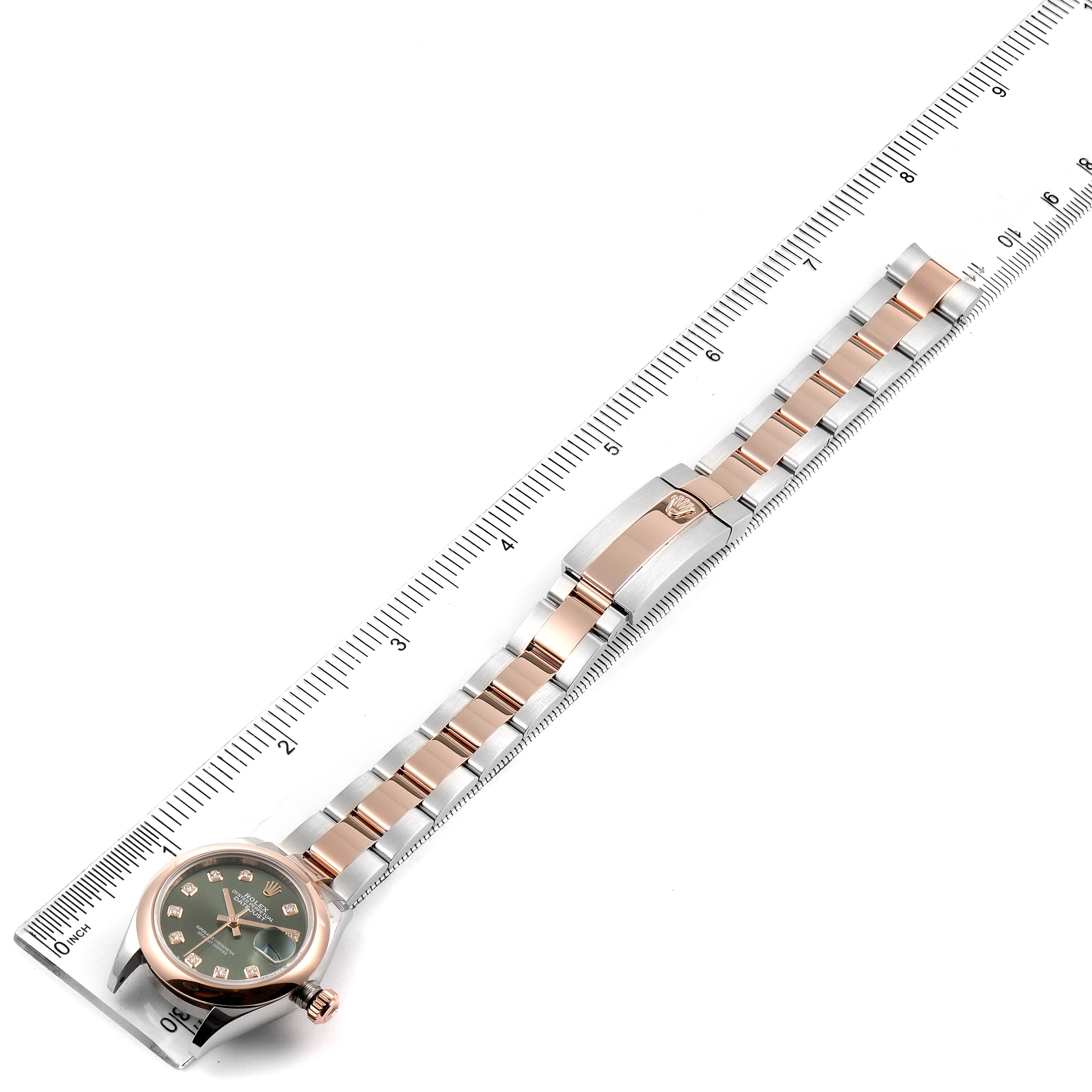 The image shows a Rolex Datejust 279161 Women's Steel and Gold (two tone) Green Dial 279161 Women's Steel and Gold (two tone) Green Dial watch from an overhead angle, including the watch face, band, and part of a ruler for scale.