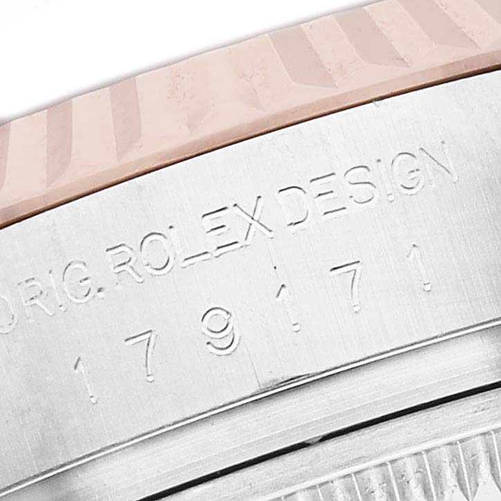 The image shows the engraved side of a Rolex Datejust 179171 Women's Steel and Gold (two tone) Pink Dial, focusing on the case with part of the bezel visible.