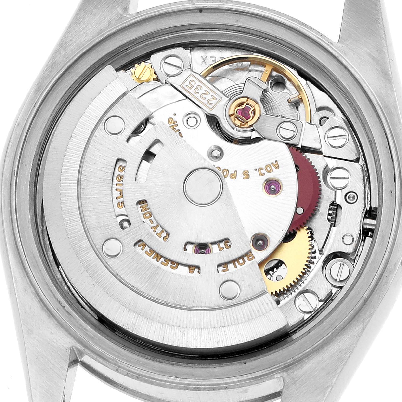 The image shows the movement from the back of a Rolex Datejust 79174 Women's Stainless Steel Pink Dial, highlighting its intricate mechanical parts and rotor.