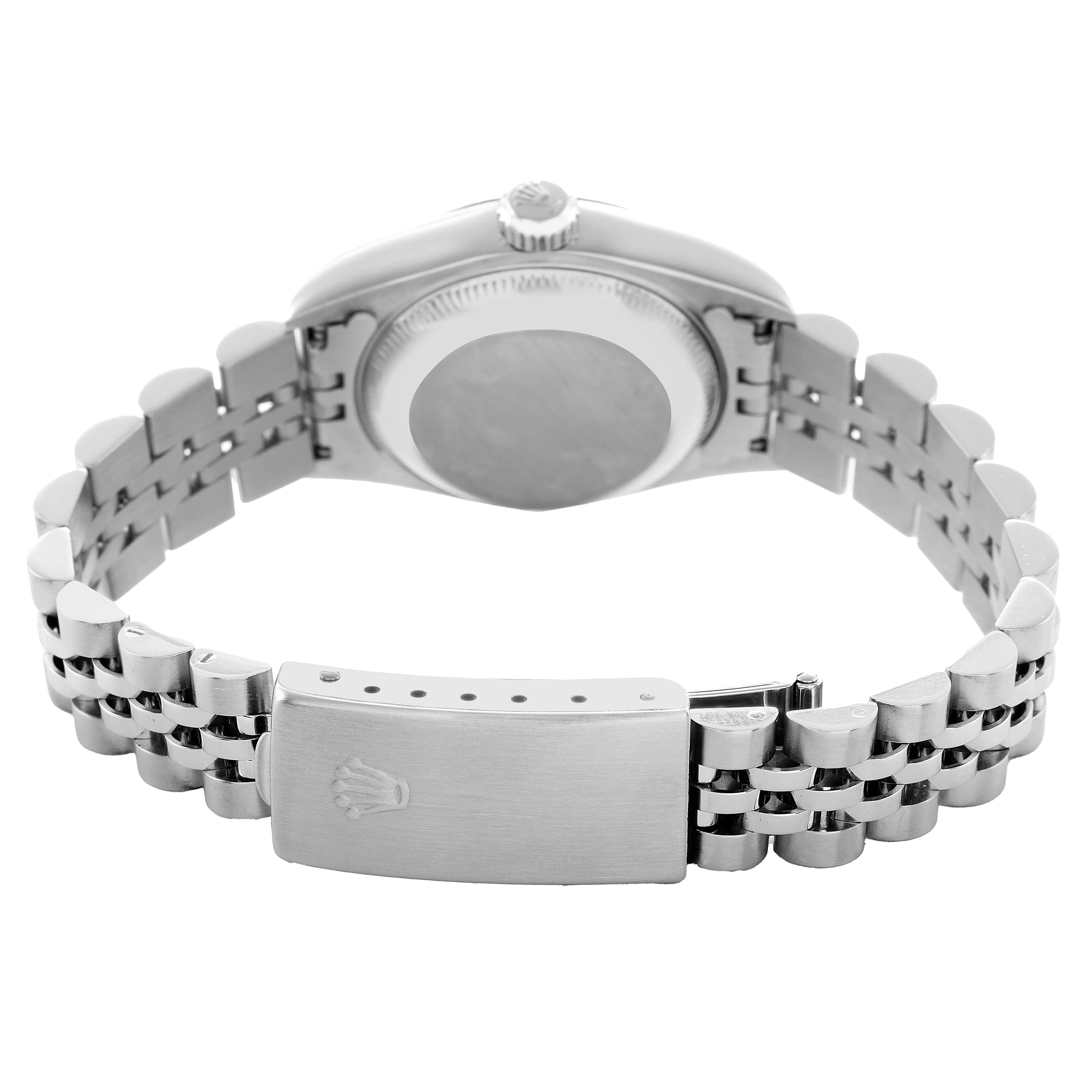 The image shows the back of the Rolex Datejust 79174 Women's Stainless Steel Pink Dial watch, highlighting the case back and metal bracelet clasp.