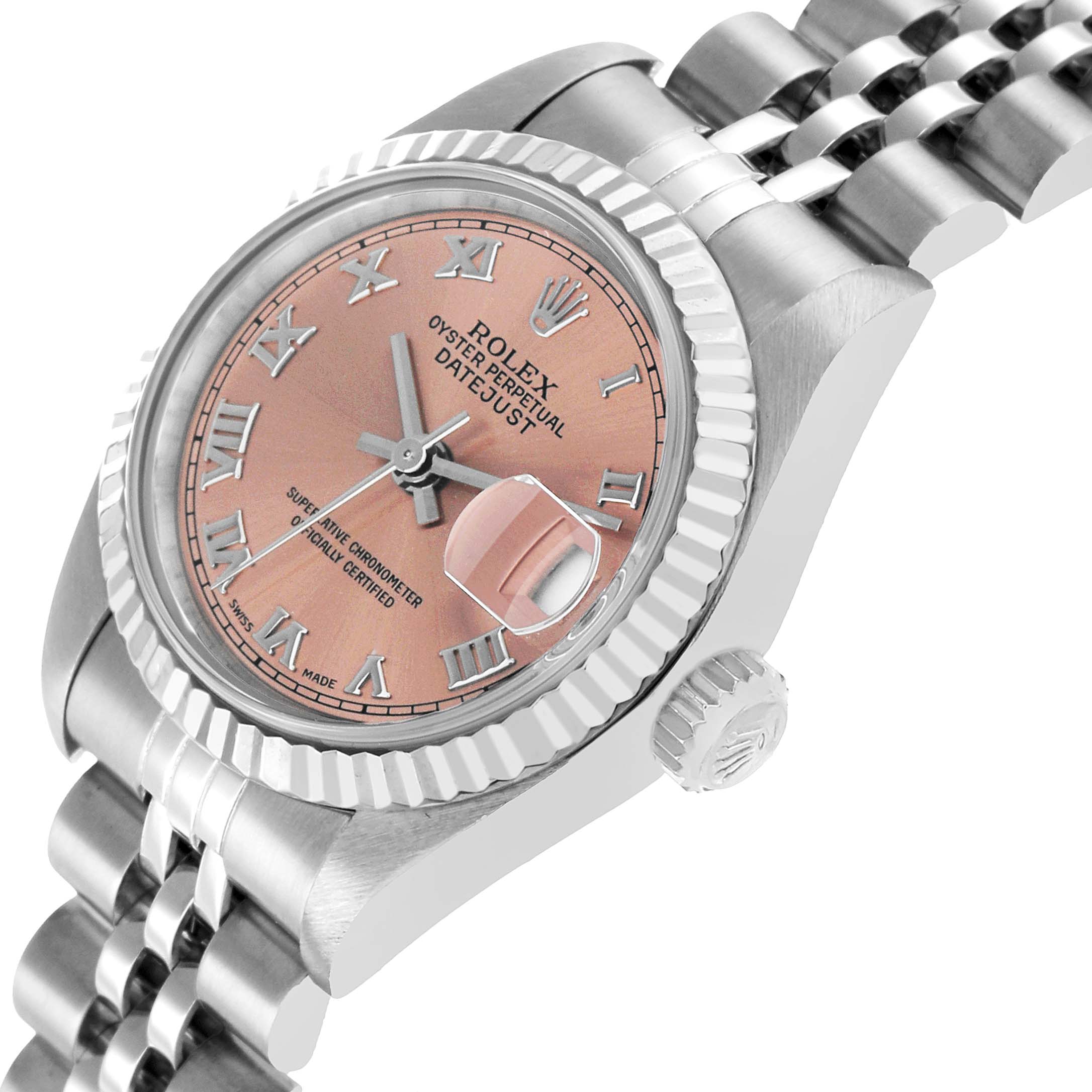 The Rolex Datejust 79174 Women's Stainless Steel Pink Dial watch is shown at a three-quarter angle, highlighting its face, bezel, bracelet, and crown.