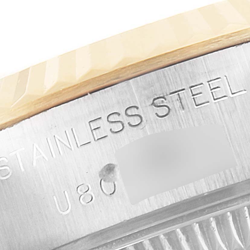 This close-up image shows the side of the stainless steel case and bezel of a Rolex Datejust 69173 Women's Steel and Gold (two tone) Silver Dial 69173 Women's Steel and Gold (two tone) Silver Dial watch.