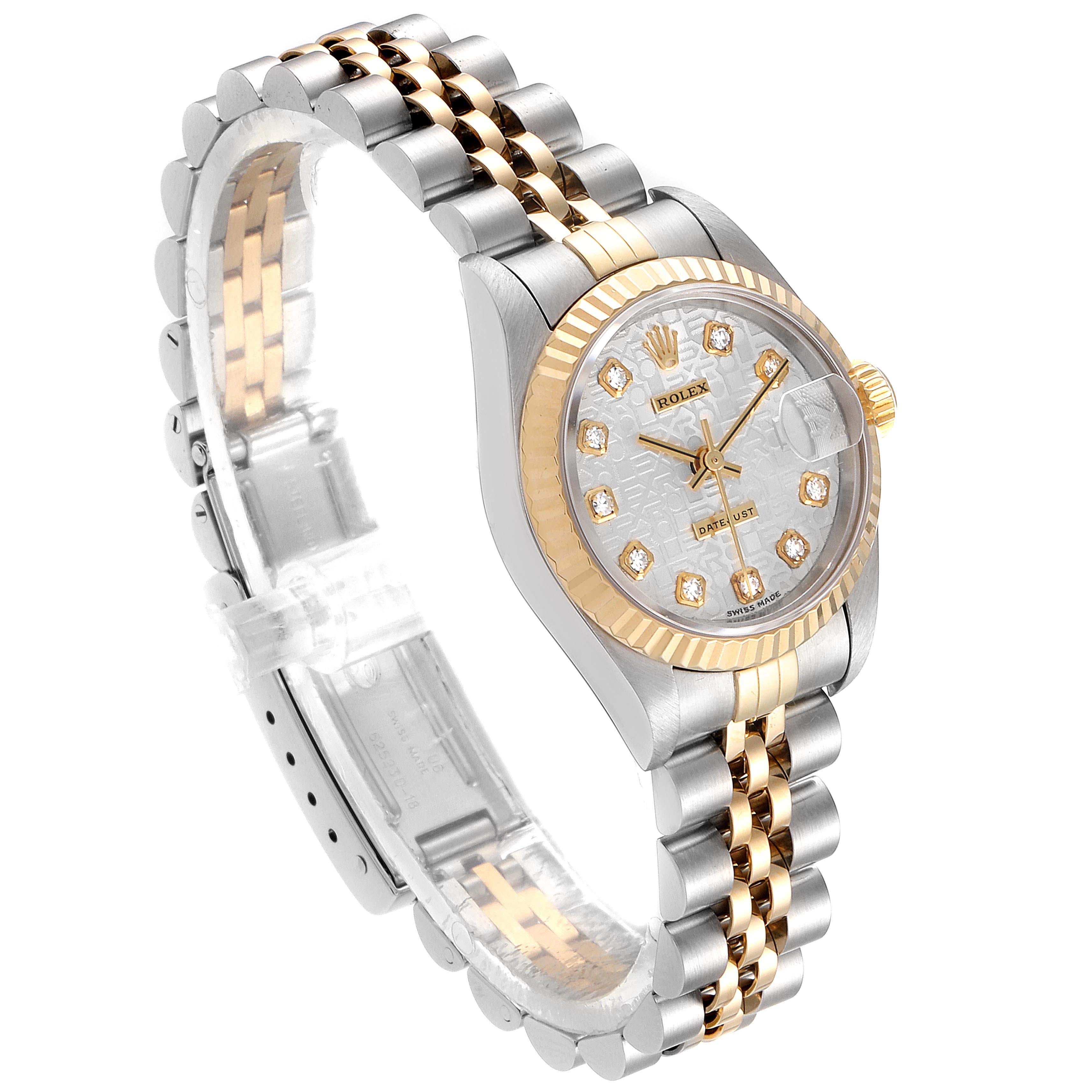 The angled view of the Rolex Datejust 69173 Women's Steel and Gold (two tone) Silver Dial 69173 Women's Steel and Gold (two tone) Silver Dial watch shows the dial, bezel, and two-tone bracelet.