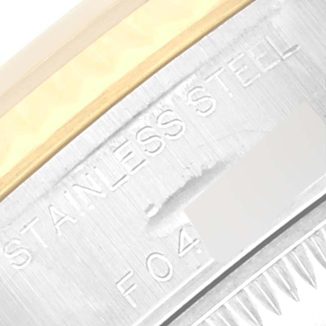 This close-up image shows the side of a Rolex Datejust 79173G Women's Steel and Gold (two tone) Silver Dial 79173G Women's Steel and Gold (two tone) Silver Dial watch, highlighting its stainless steel and gold components.