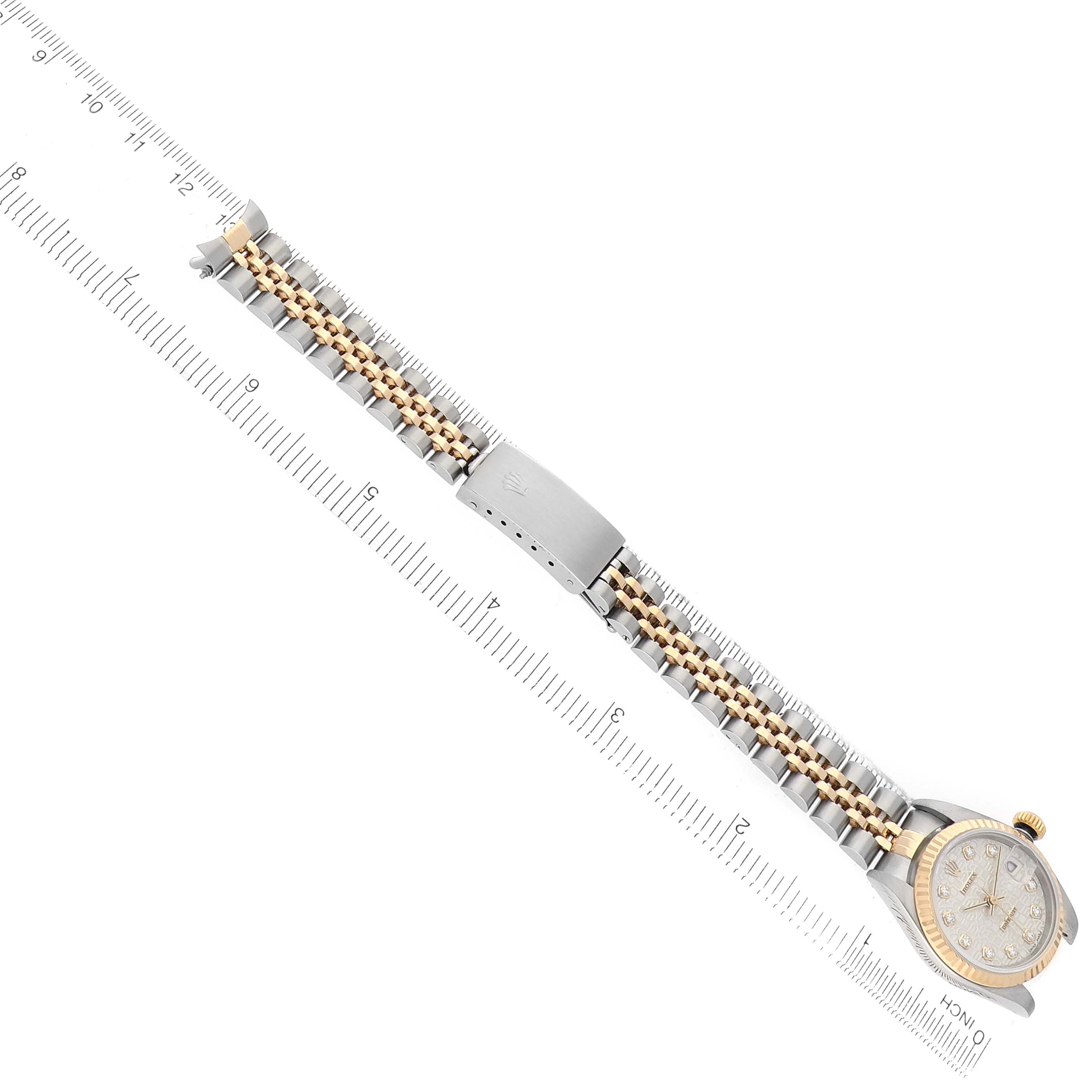 The Rolex Datejust 79173 Women's Steel and Gold (two tone) Silver Dial watch is shown from a top view, highlighting the bracelet, bezel, and part of the dial.
