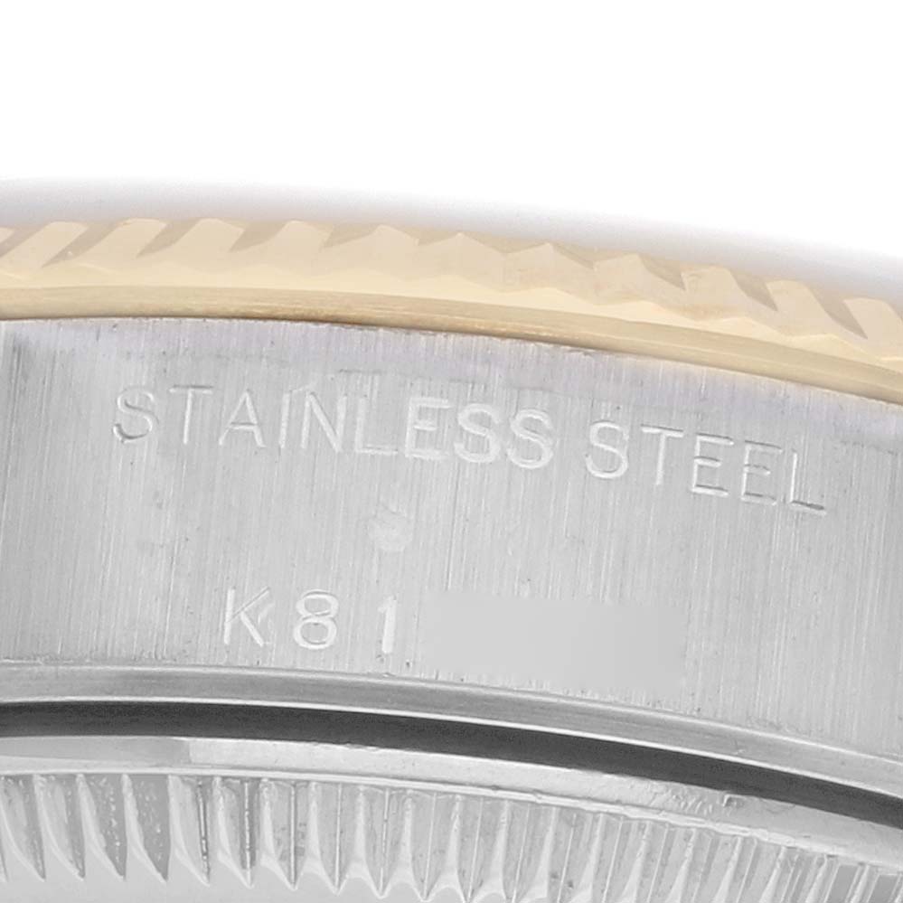 The image shows a close-up of the side of a Rolex Datejust 79173 Women's Steel and Gold (two tone) Silver Dial, highlighting the stainless steel part and model engraving.