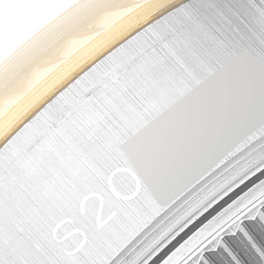 This close-up image of the Rolex Datejust 69173 Women's Steel and Gold (two tone) Champagne Dial 69173 Women's Steel and Gold (two tone) Champagne Dial model displays a portion of its bezel and dial.