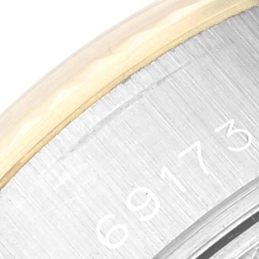 The image shows a close-up of the serial number inside the case back of a Rolex Datejust 69173 Women's Steel and Gold (two tone) Champagne Dial 69173 Women's Steel and Gold (two tone) Champagne Dial watch.