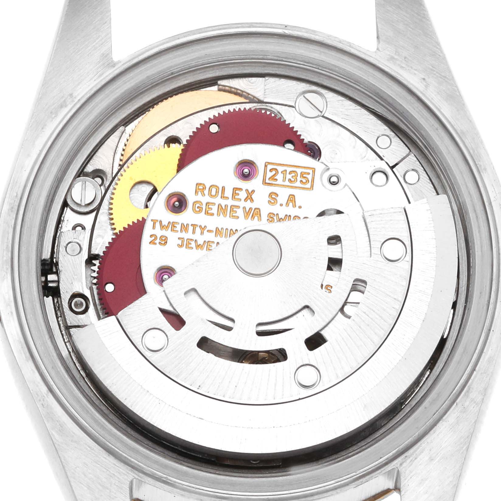 The image shows the exposed movement of a Rolex Datejust 69173 Women's Steel and Gold (two tone) Champagne Dial watch, highlighting gears and the rotor from a top view.